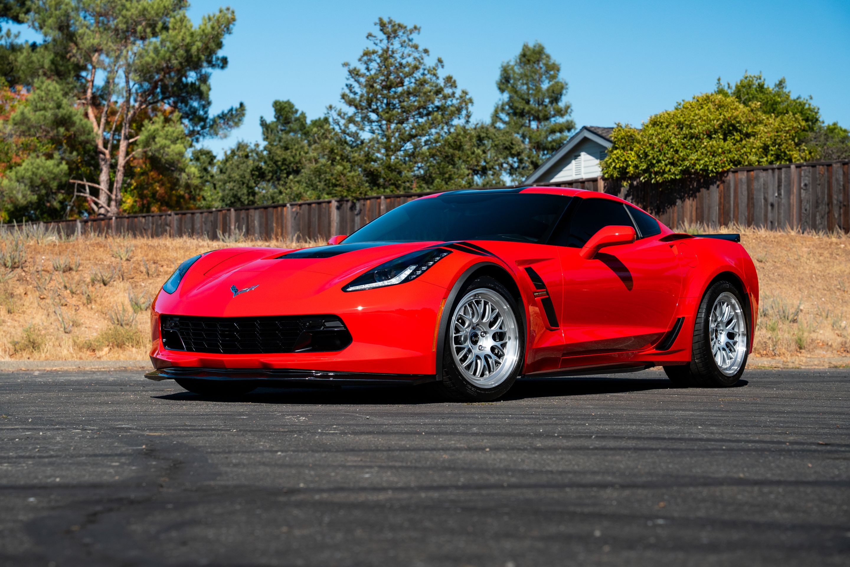 Red Chevrolet C7 Corvette Grand Sport with 18"/19" ML-10RT Apex wheels in Machined Lip Race Silver
