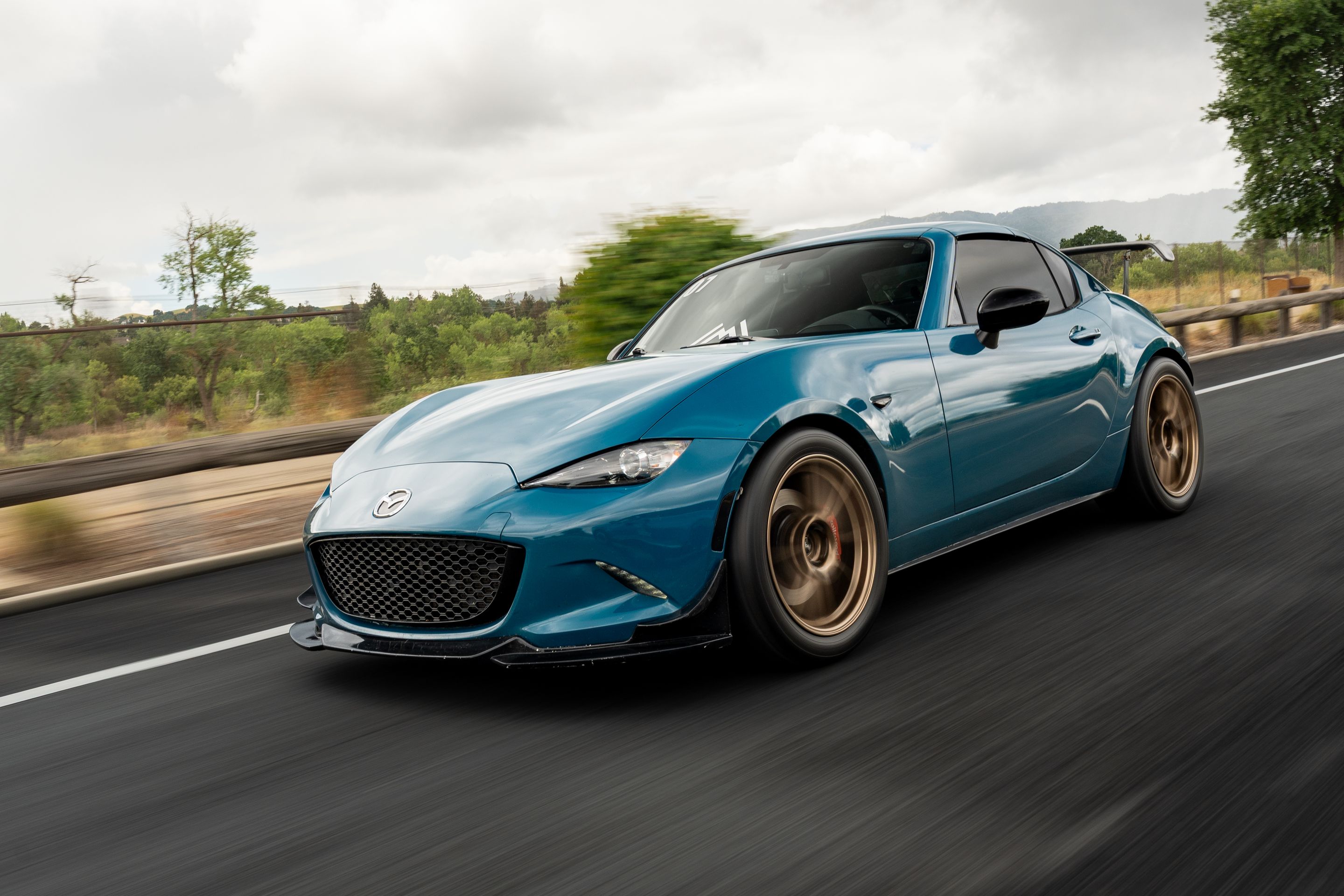 Blue Mazda ND MX-5 Miata with 17" SM-8RS Apex wheels in Satin Bronze
