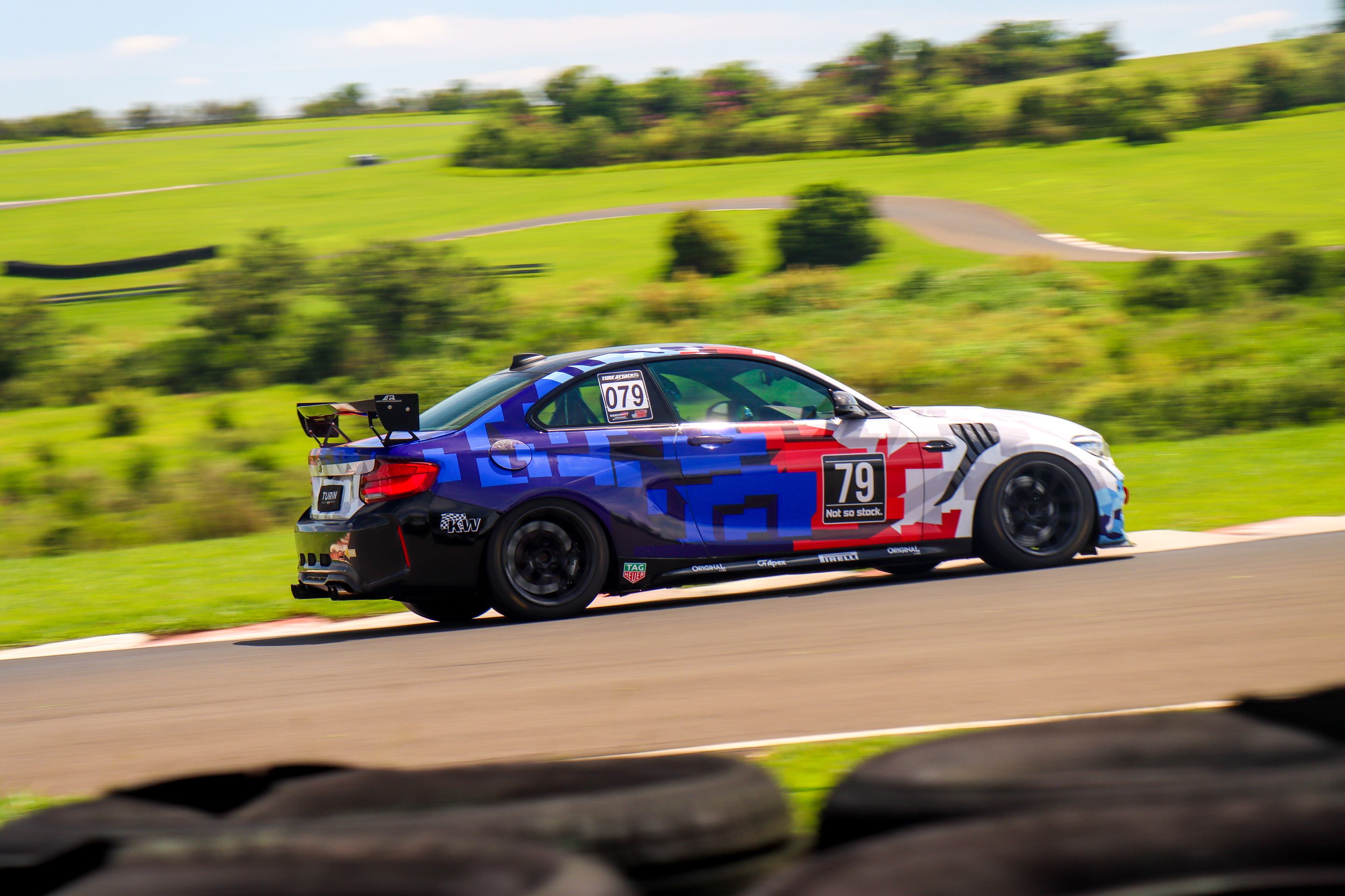 Multicolor BMW F87 M2 with 18" EC-7 Apex wheels in Satin Black