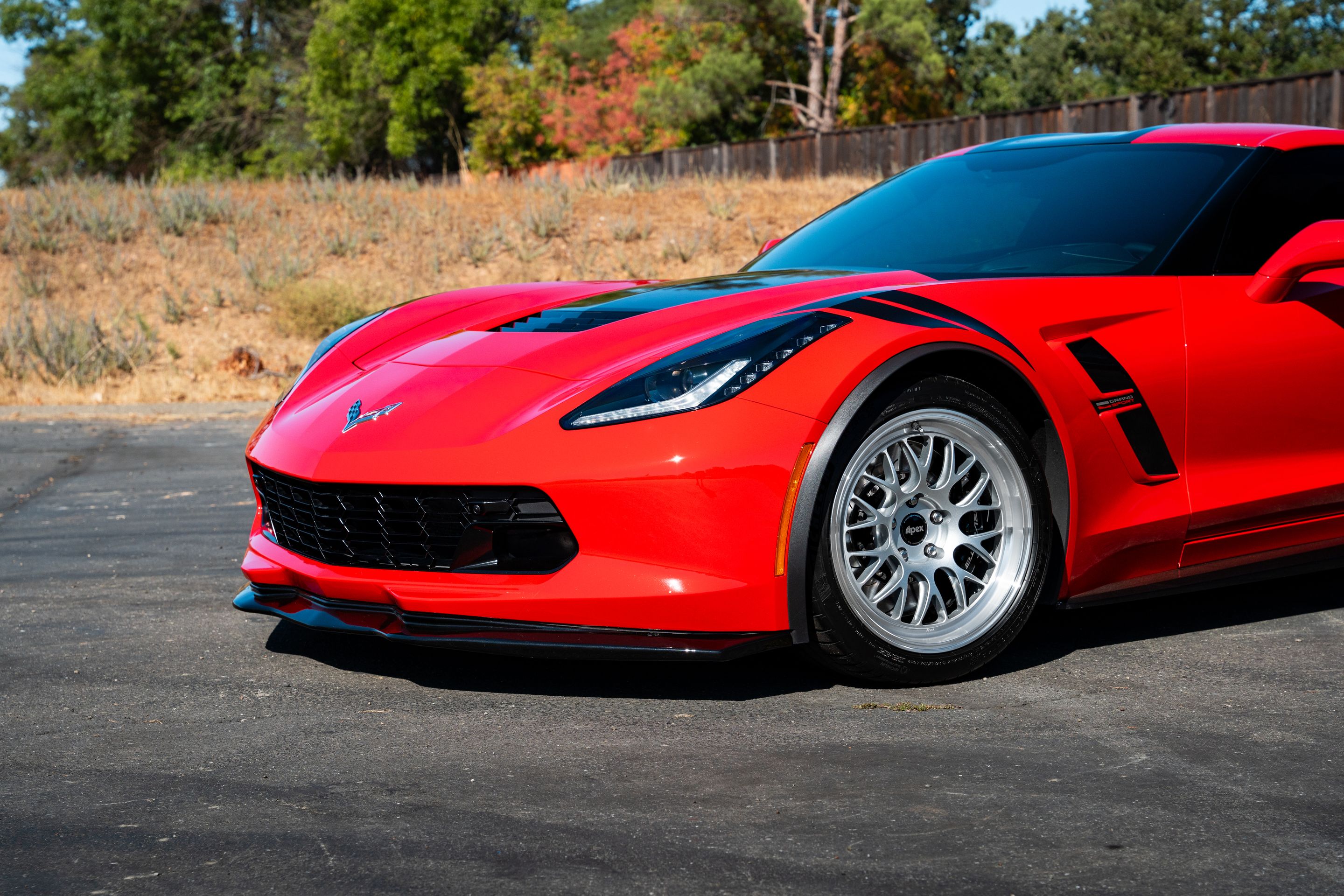 Red Chevrolet C7 Corvette Grand Sport with 18"/19" ML-10RT Apex wheels in Machined Lip Race Silver
