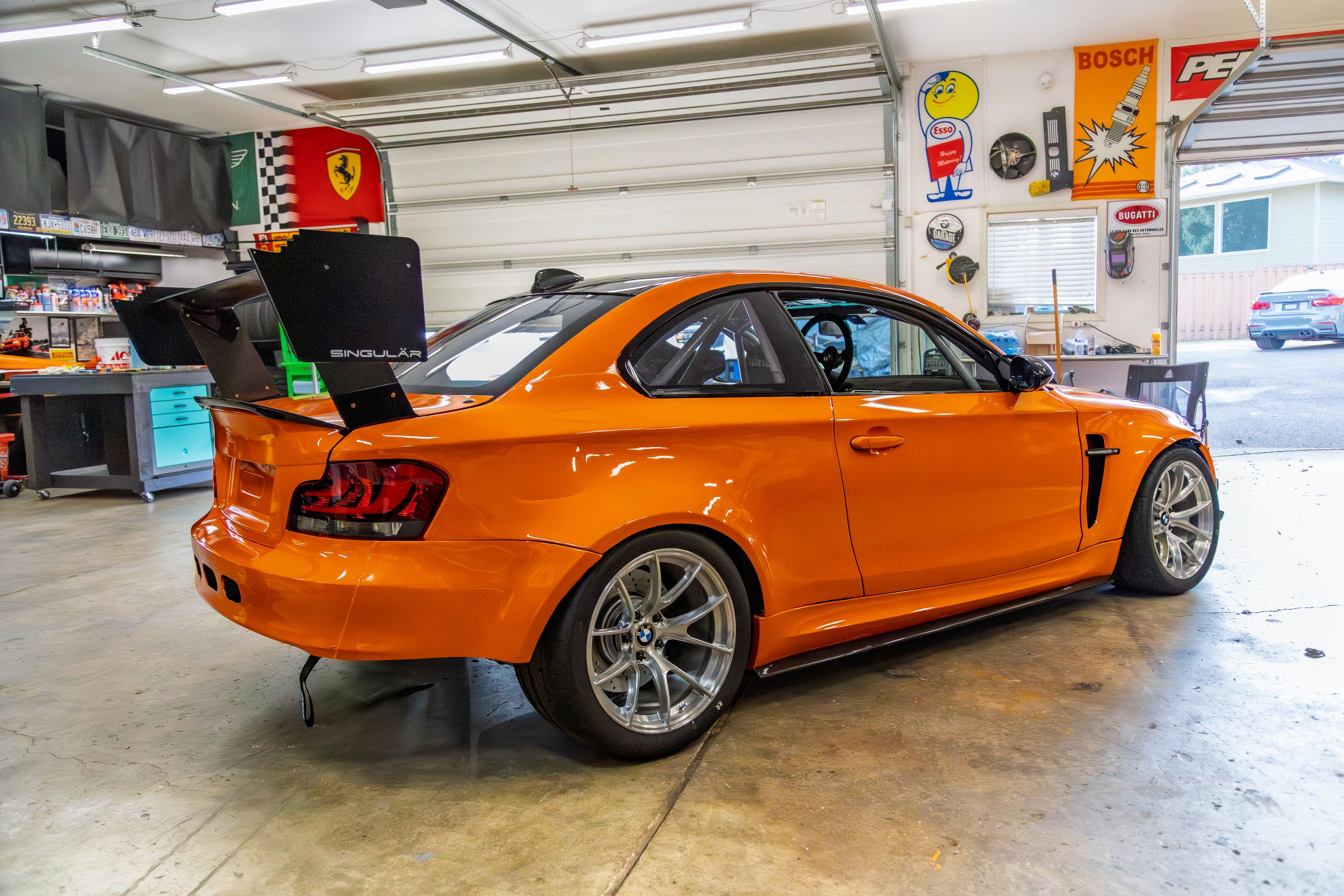 Orange BMW E82 1M with 18" VS-5RS Apex wheels in Brushed Clear