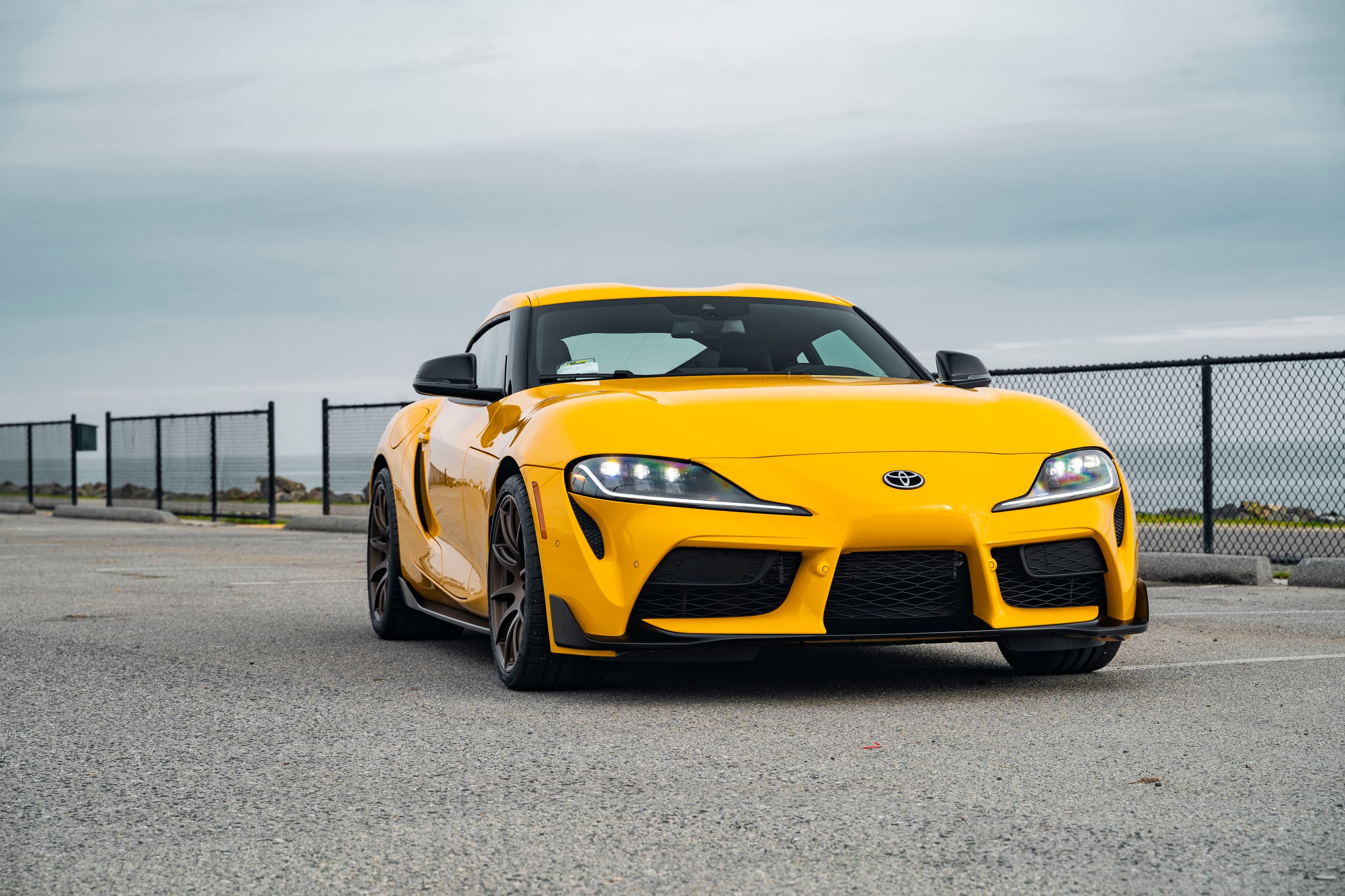 Yellow Toyota GR Supra with 19" SM-10 Apex wheels in Satin Bronze