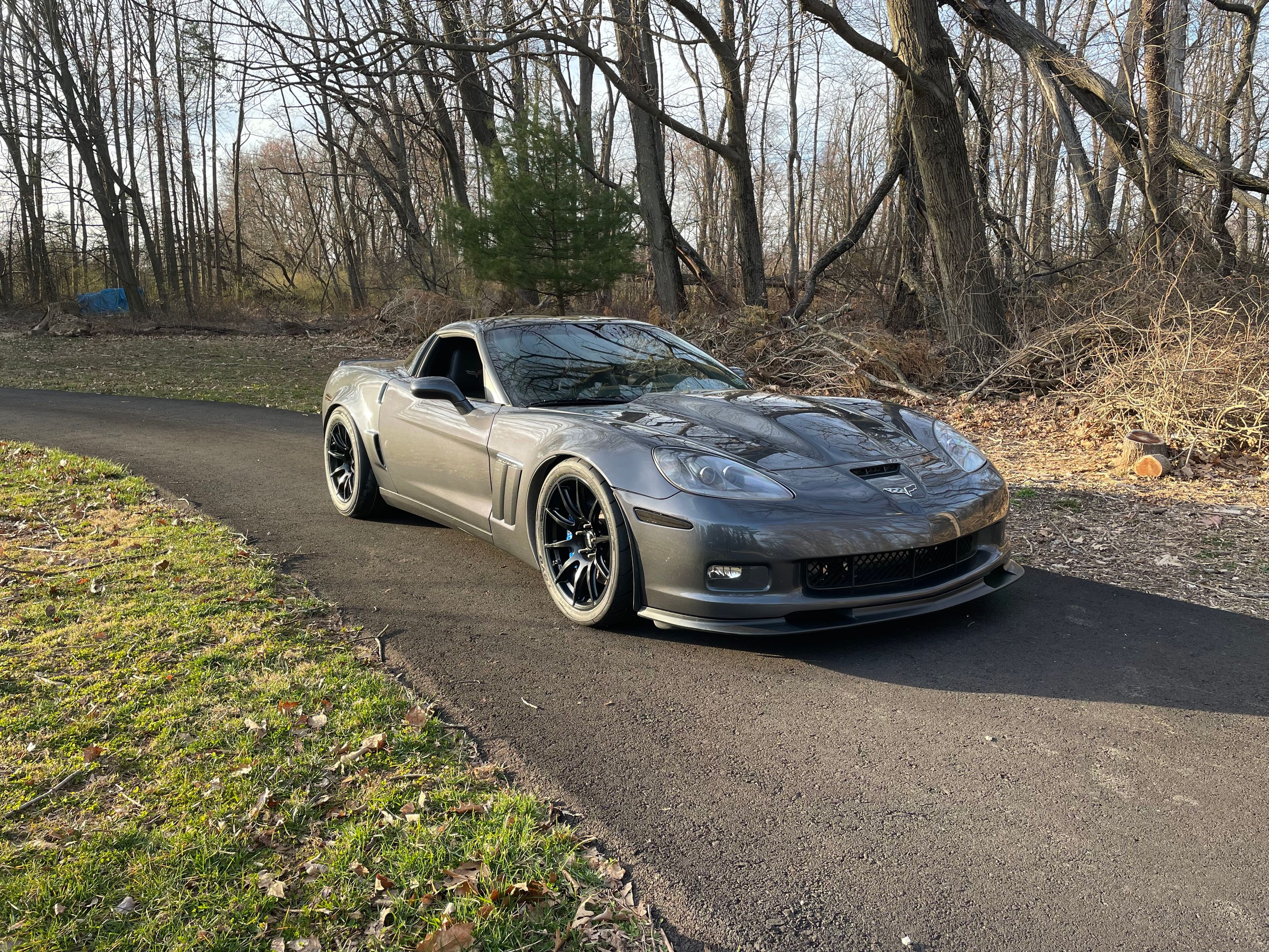 Grey Chevrolet C6 Corvette Grand Sport with 19"/18" SM-10 Apex wheels in Satin Black