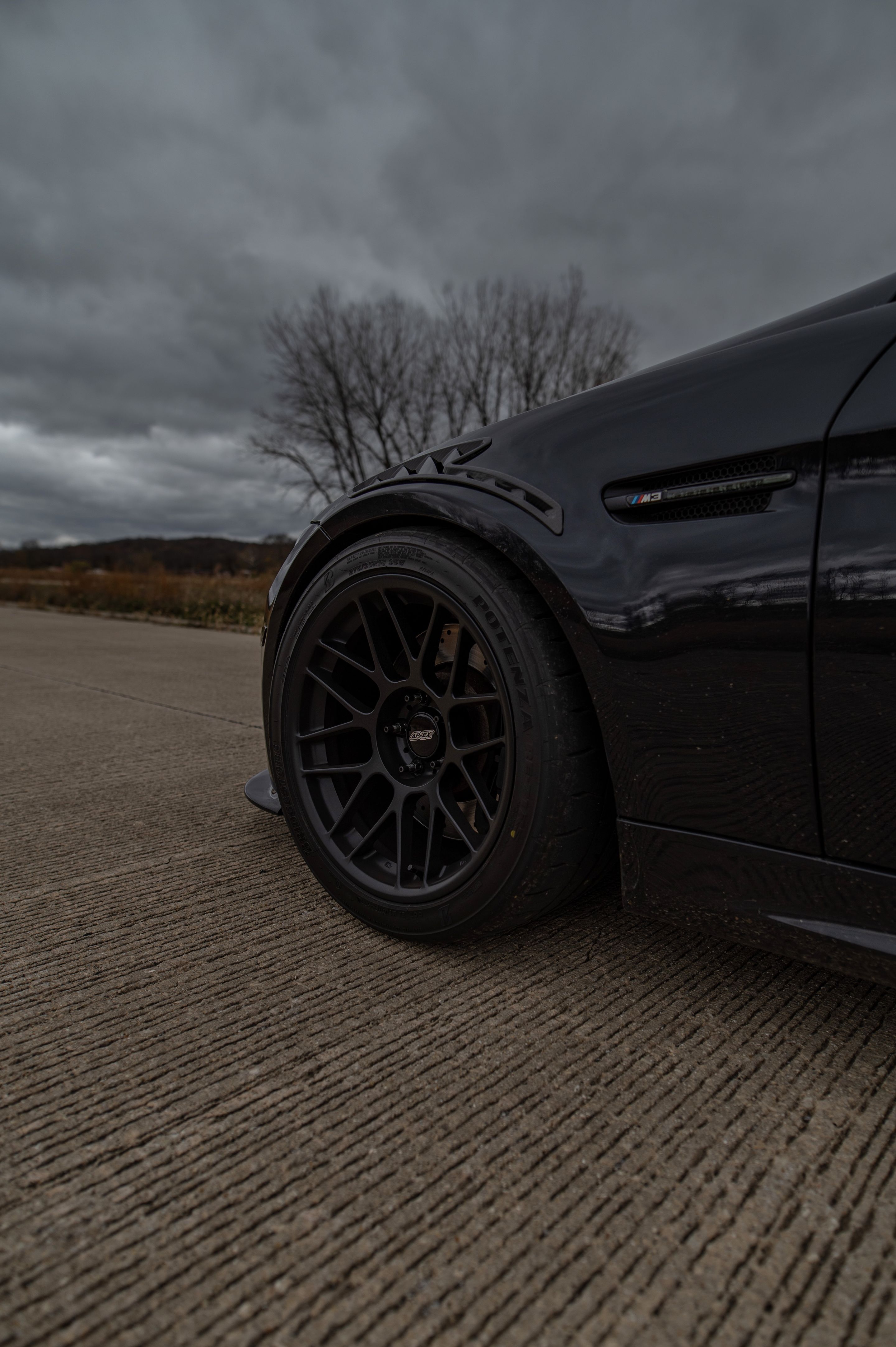 Black BMW E90 Sedan M3 with 18" ARC-8 Apex wheels in Satin Black