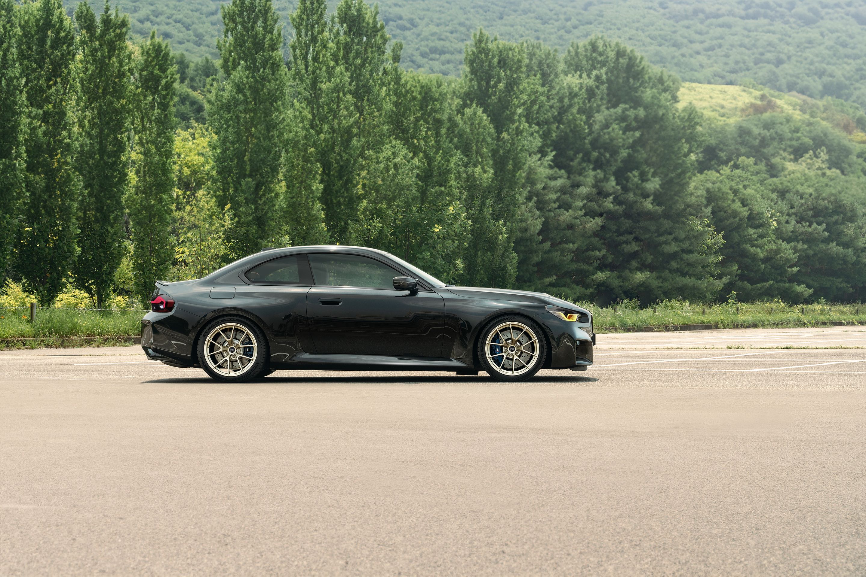 Black BMW G87 M2 with 19" VS-5RS Apex wheels in Motorsport Gold