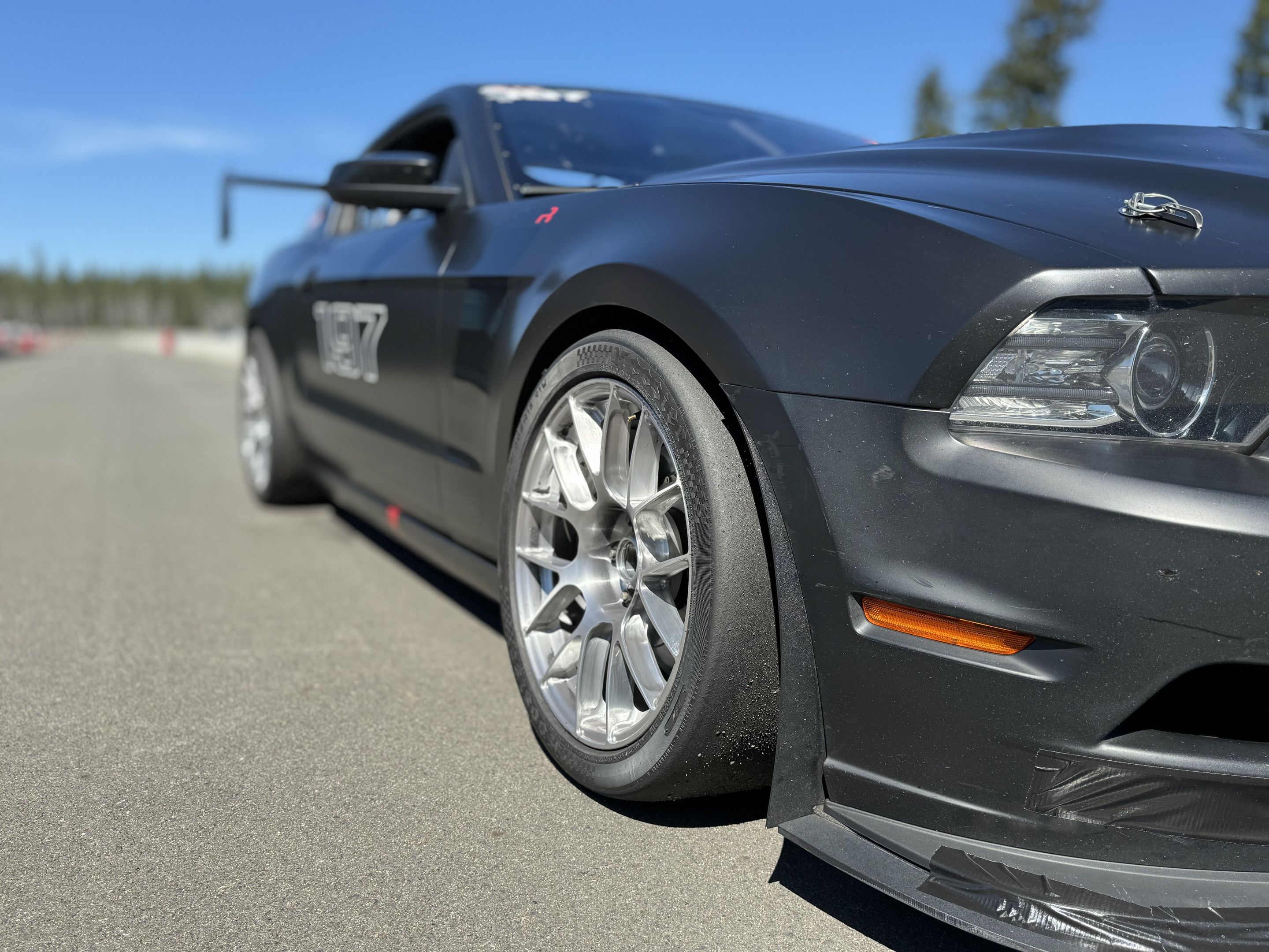 Black Ford S197 Mustang GT with 18" EC-7RS Apex wheels in Brushed Clear