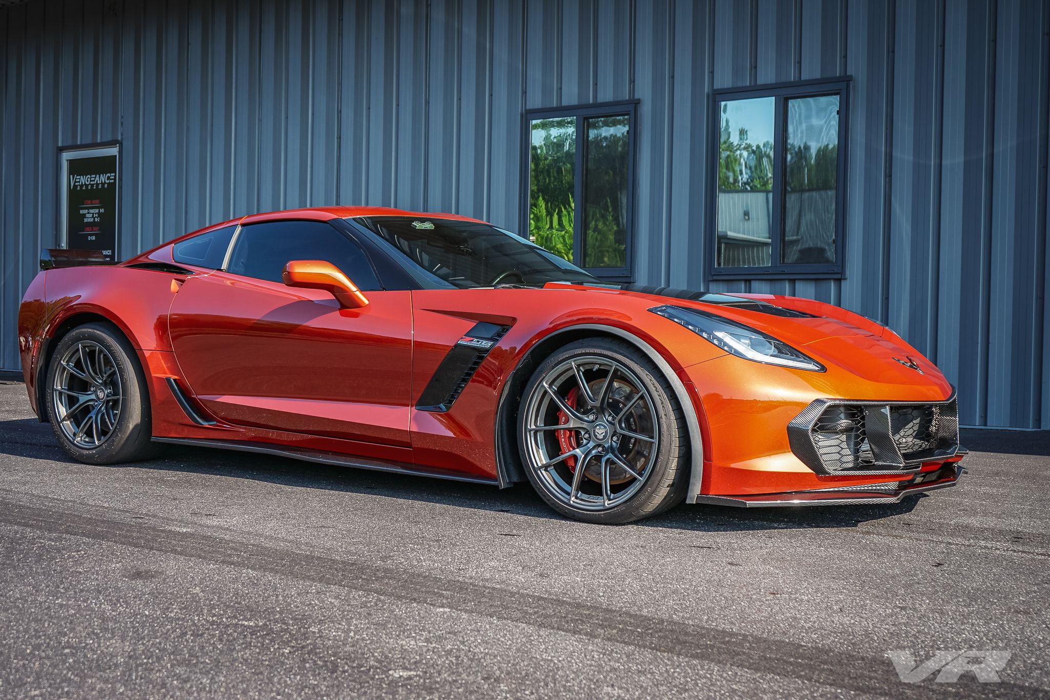 Orange Chevrolet C7 Corvette Z06 with 19"/18" VS-5RS Apex wheels in Anthracite
