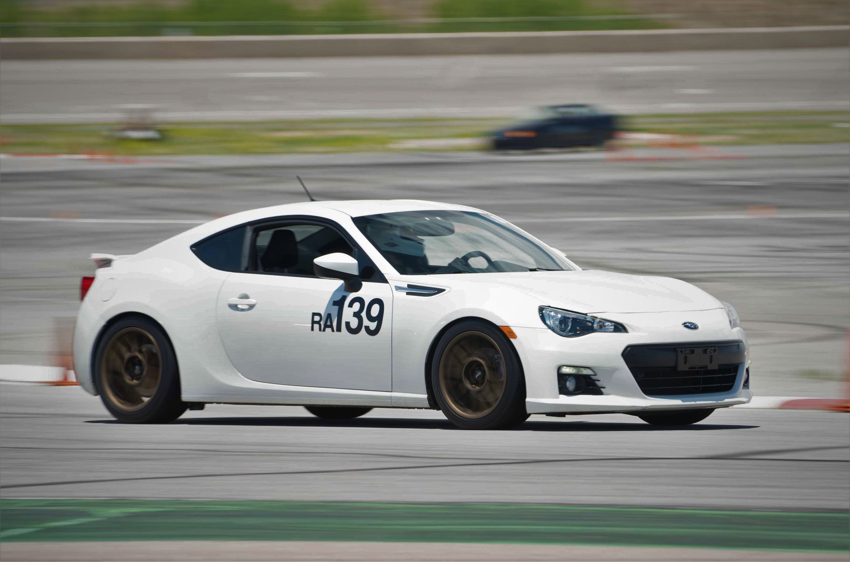 White Subaru ZC6 / Gen 1 BRZ with 17" ARC-8 Apex wheels in Satin Bronze