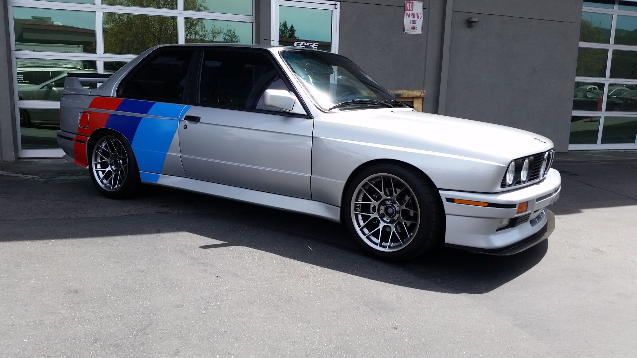 Silver BMW E30 M3 with 17" ARC-8 Apex wheels in Hyper Black