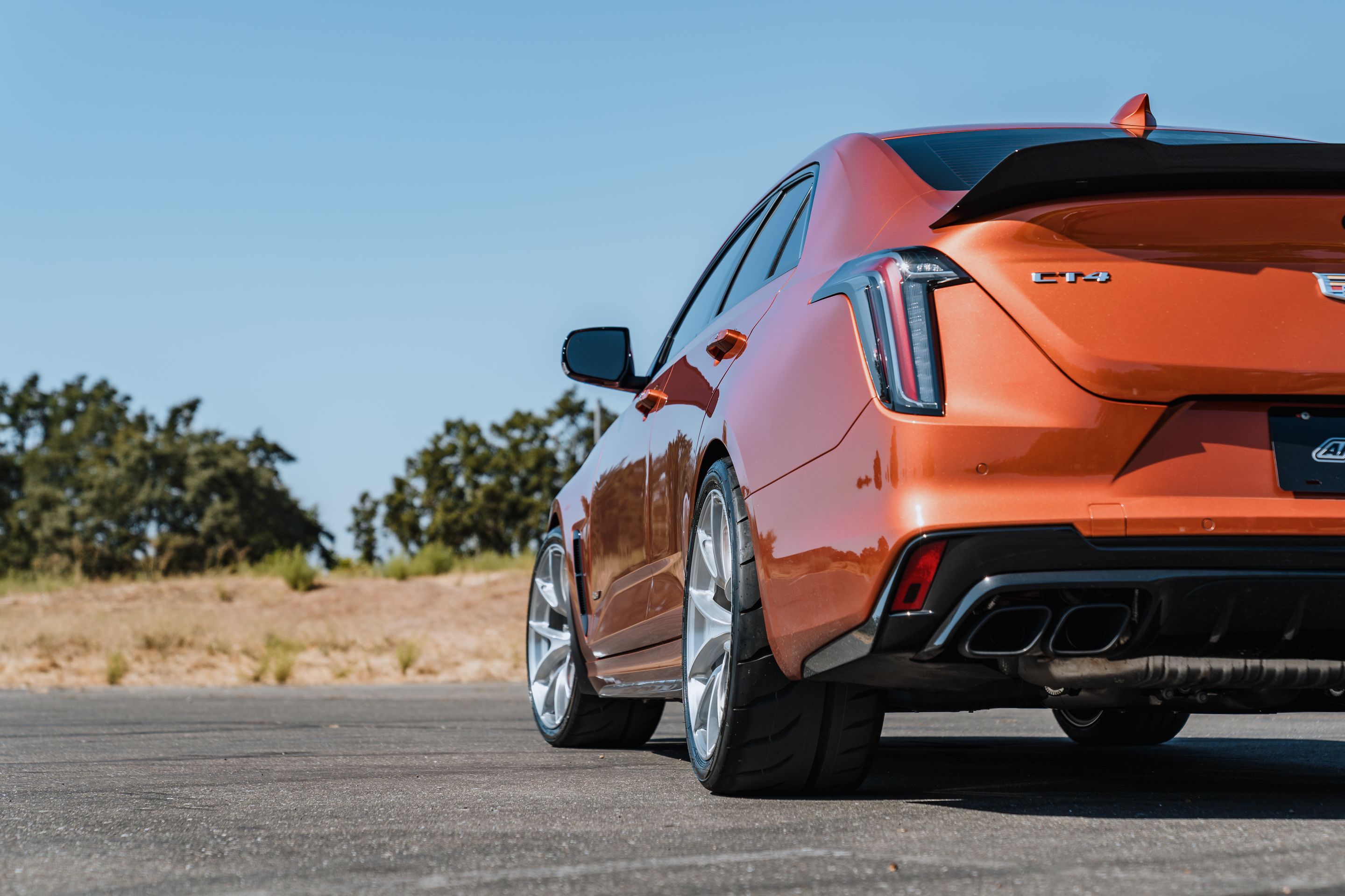 Orange Cadillac CT4-V Blackwing with 19" VS-5RS Apex wheels in Brushed Clear