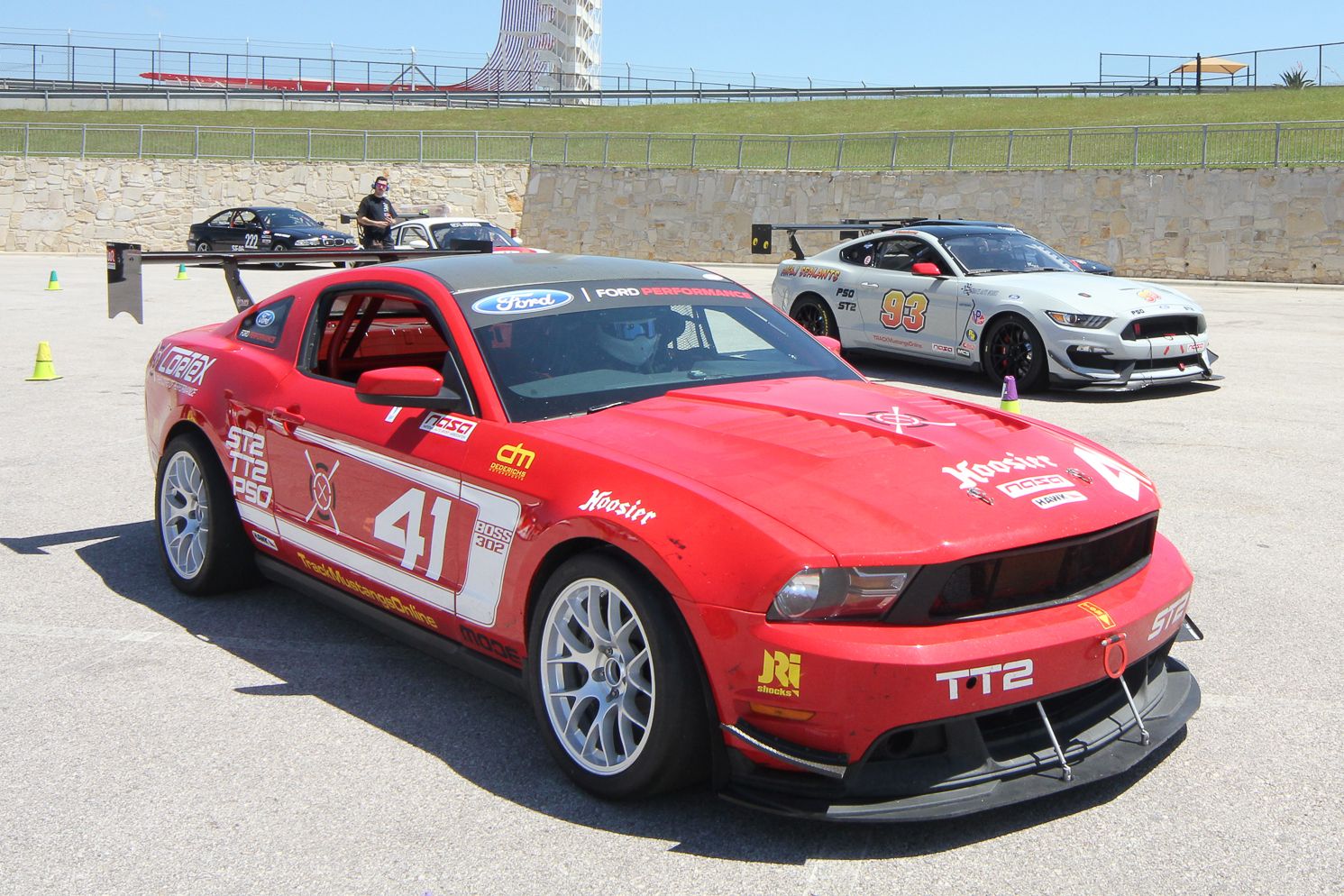 Red Ford S197 Mustang Boss 302 with 18" EC-7 Apex wheels in Race Silver