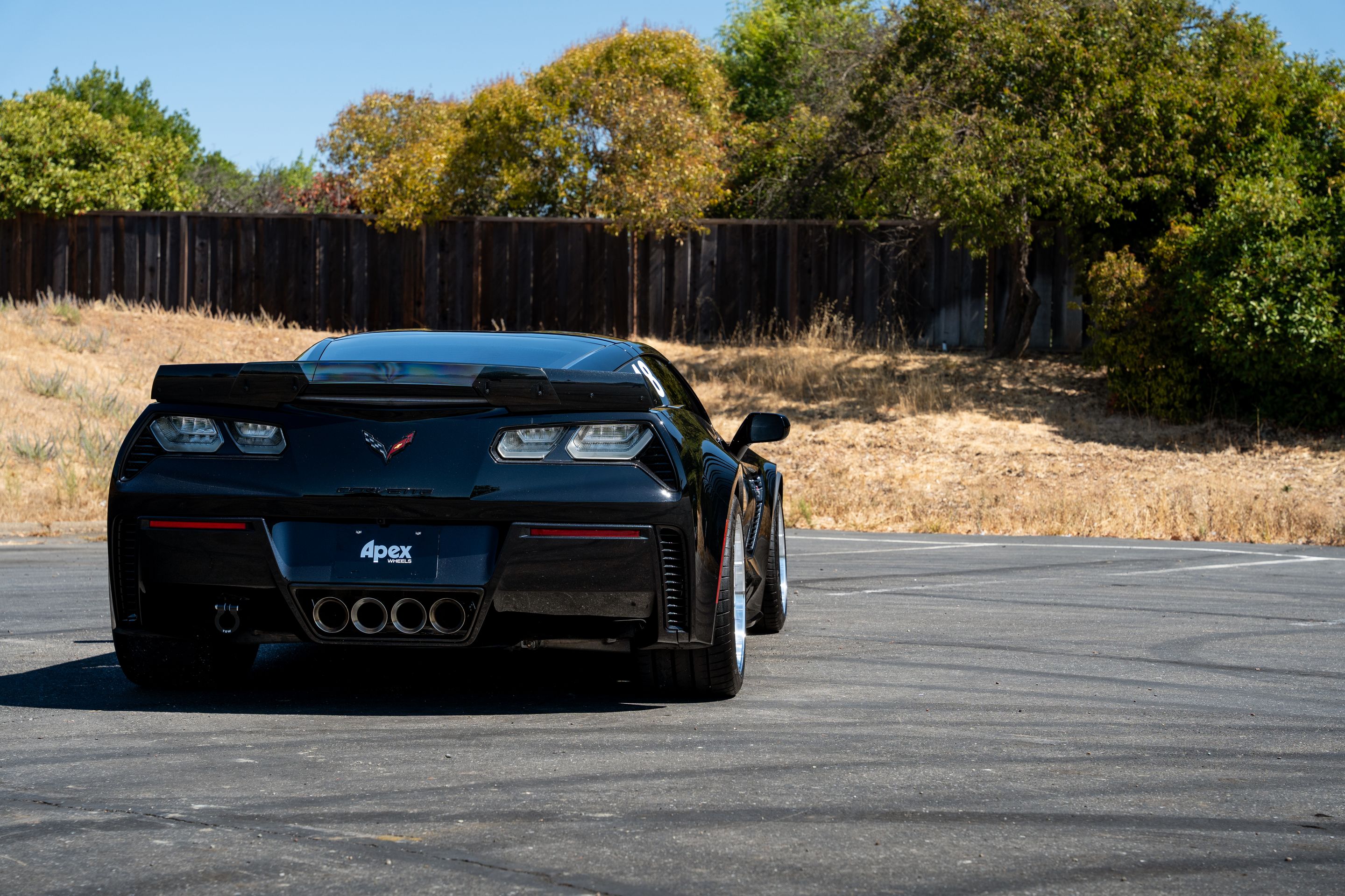 Black Chevrolet C7 Corvette Z06 with 18"/19" ML-10RT Apex wheels in Machined Lip Race Silver
