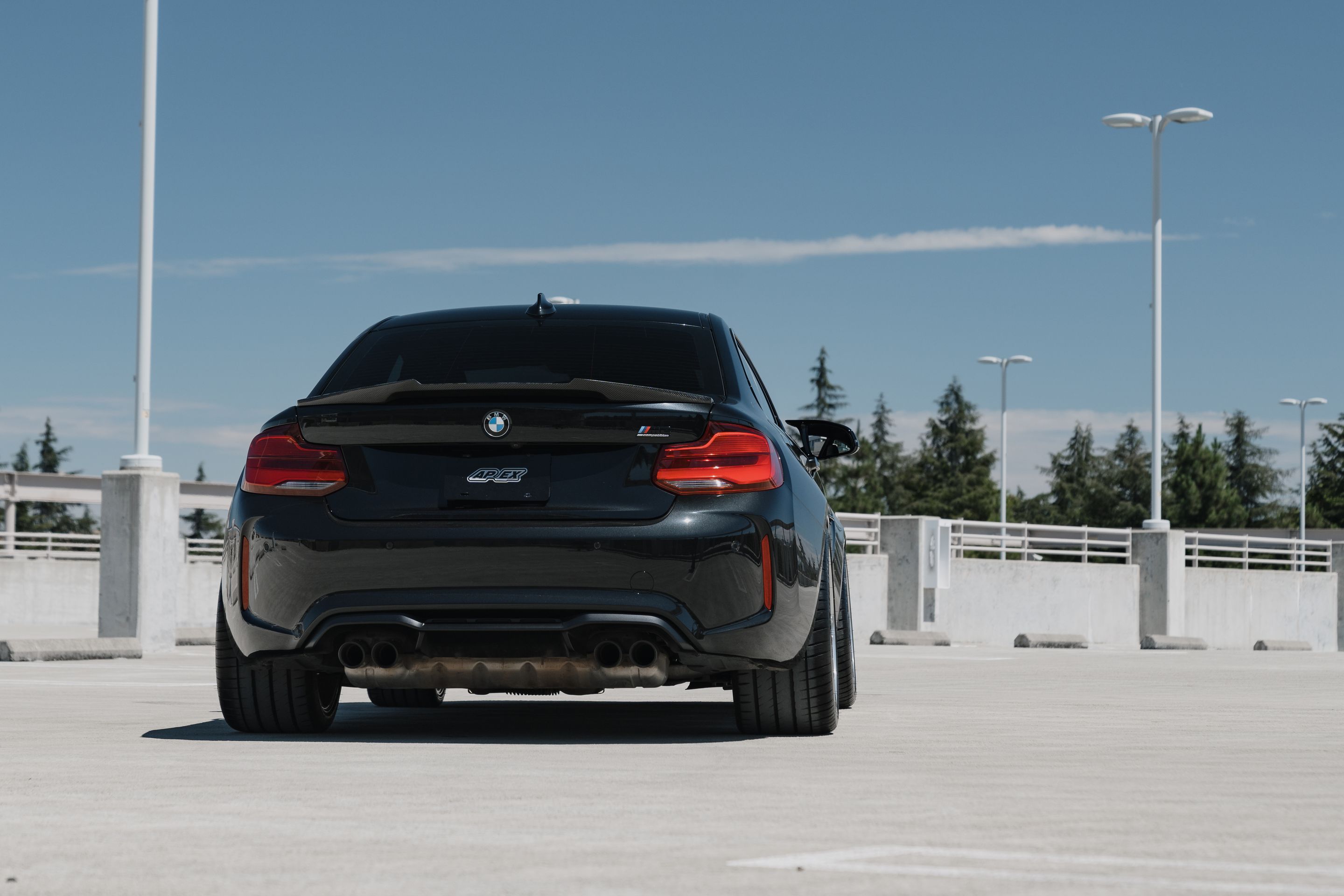 Black BMW F87 M2 with 19" ARC-8RT Apex wheels in Brushed Clear