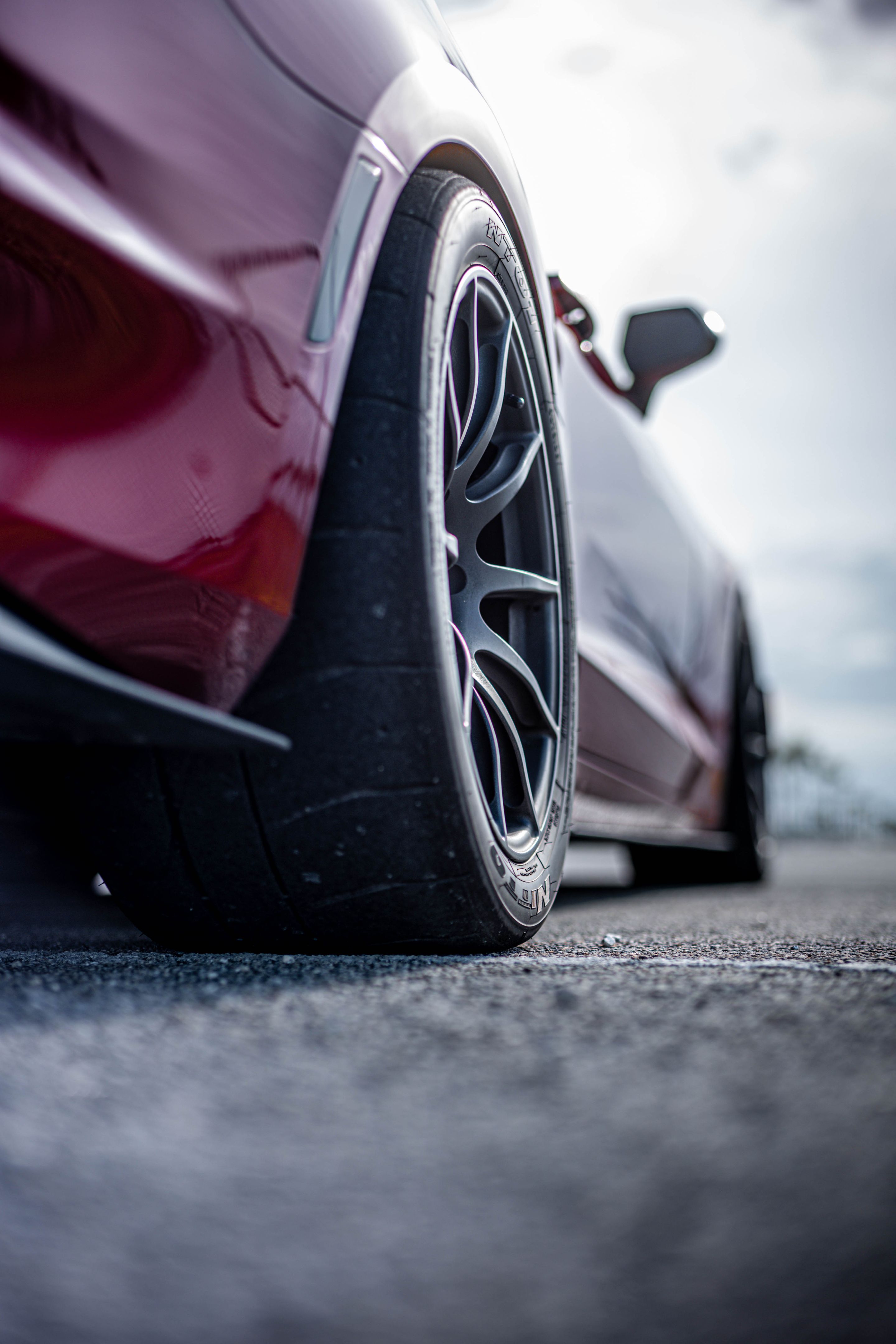Red Chevrolet 6th Gen Camaro SS with 19" SM-10 Apex wheels in Satin Black