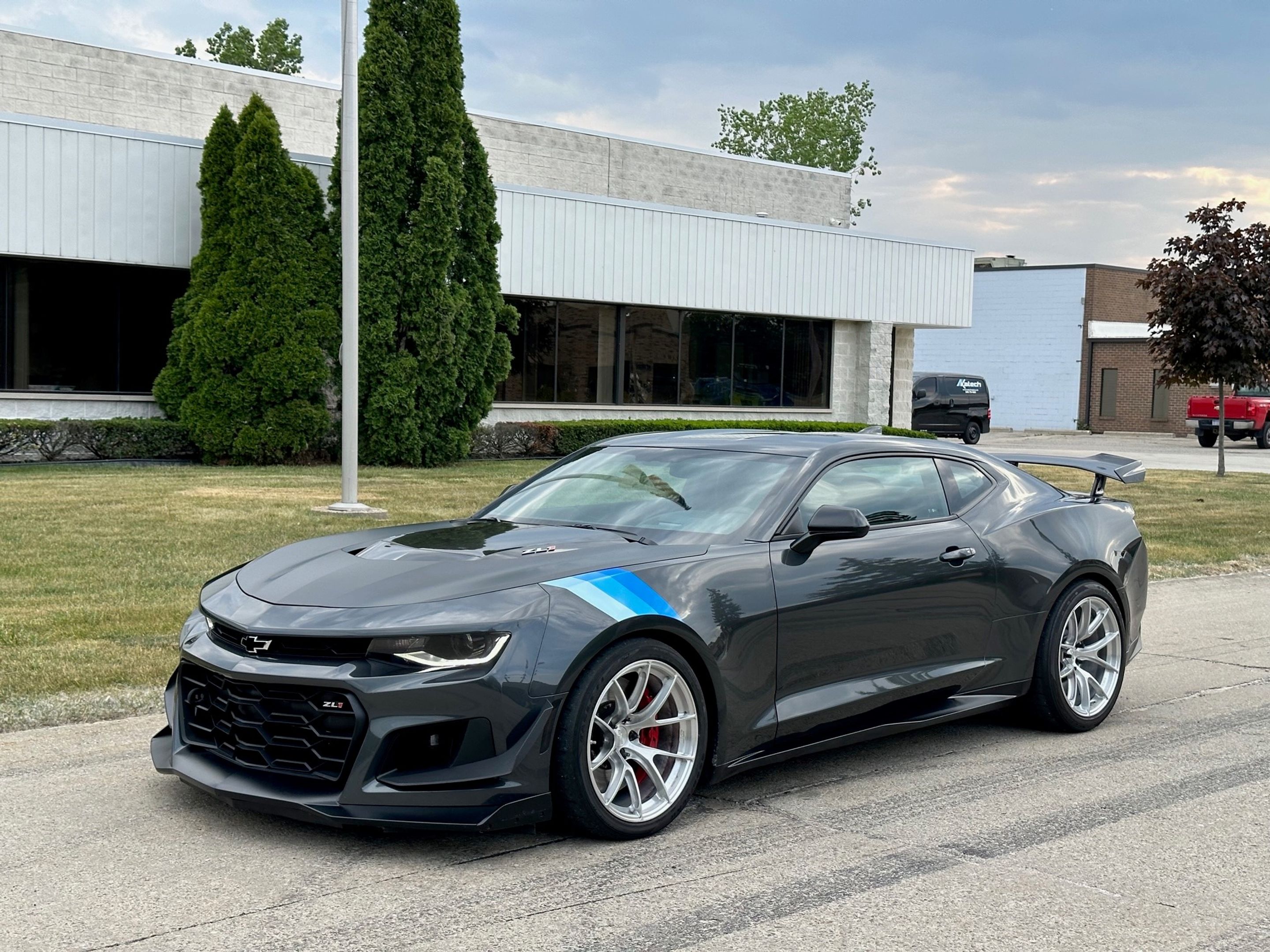 Grey Chevrolet 6th Gen Camaro ZL1 1LE with 19" VS-5RS Apex wheels in Brushed Clear