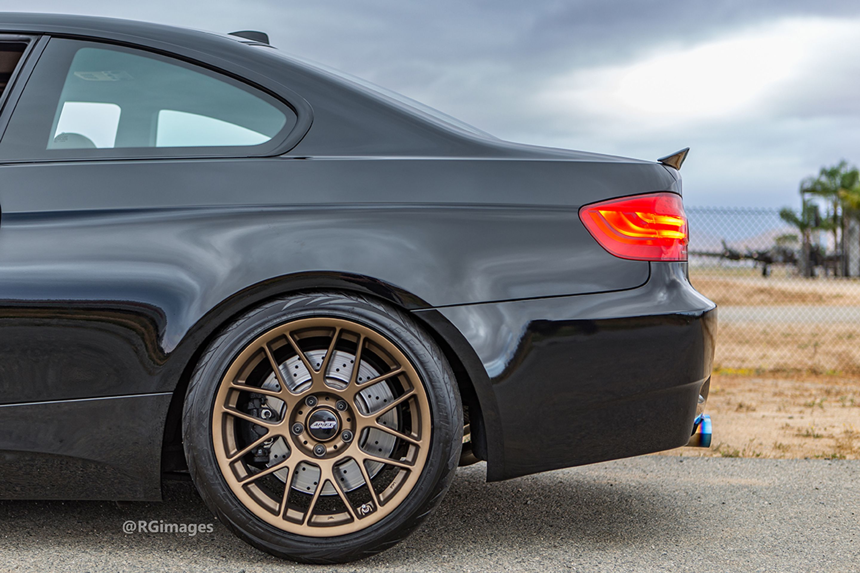Black BMW E92 Coupe M3 with 18" ARC-8 Apex wheels in Satin Bronze