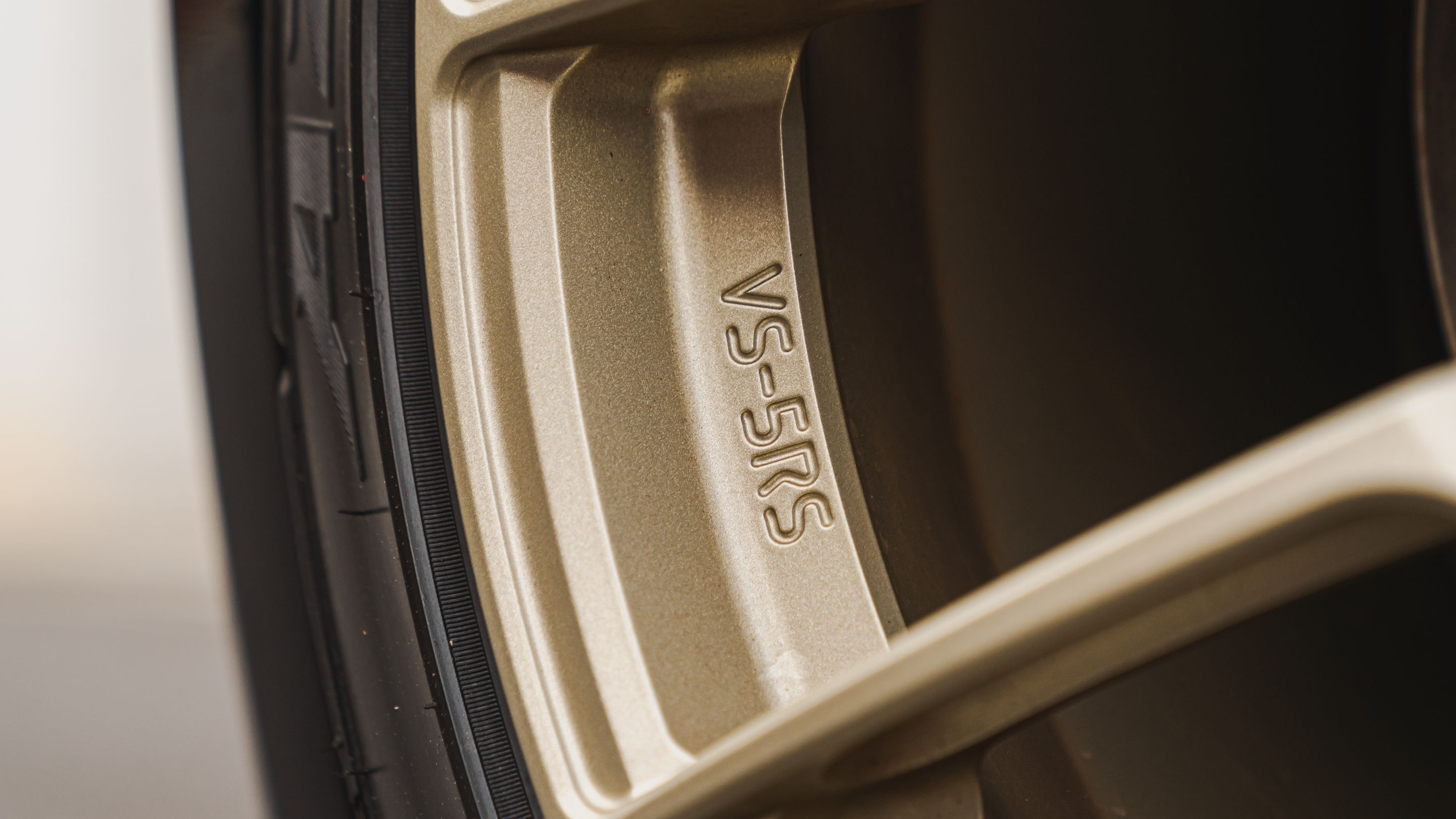 Black BMW E82 Coupe 1 Series with 18" VS-5RS Apex wheels in Motorsport Gold