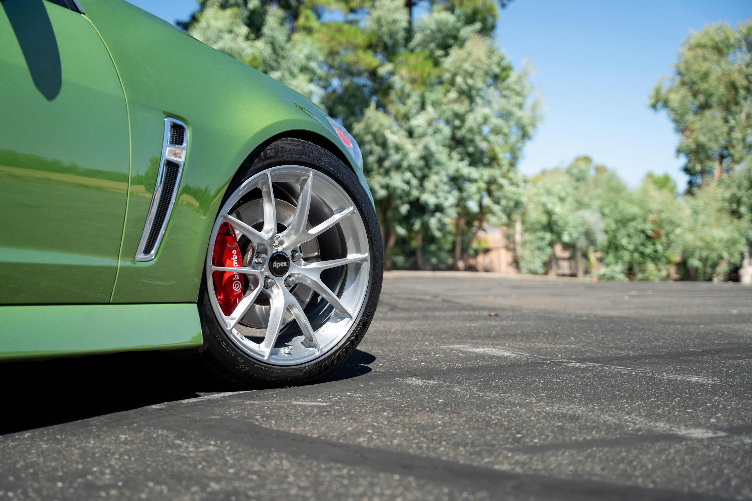 Green Chevrolet SS with 19" VS-5RS Apex wheels in Brushed Clear