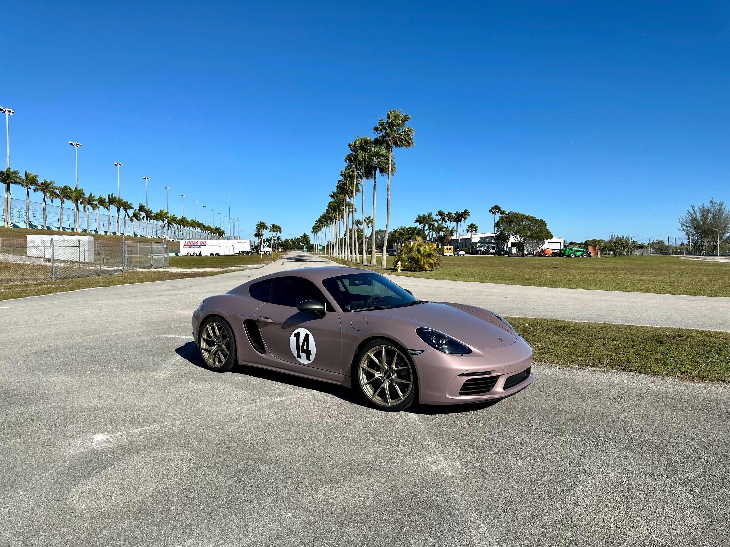 Pink Porsche 718 Cayman T with 20" VS-5RS Apex wheels in Motorsport Gold