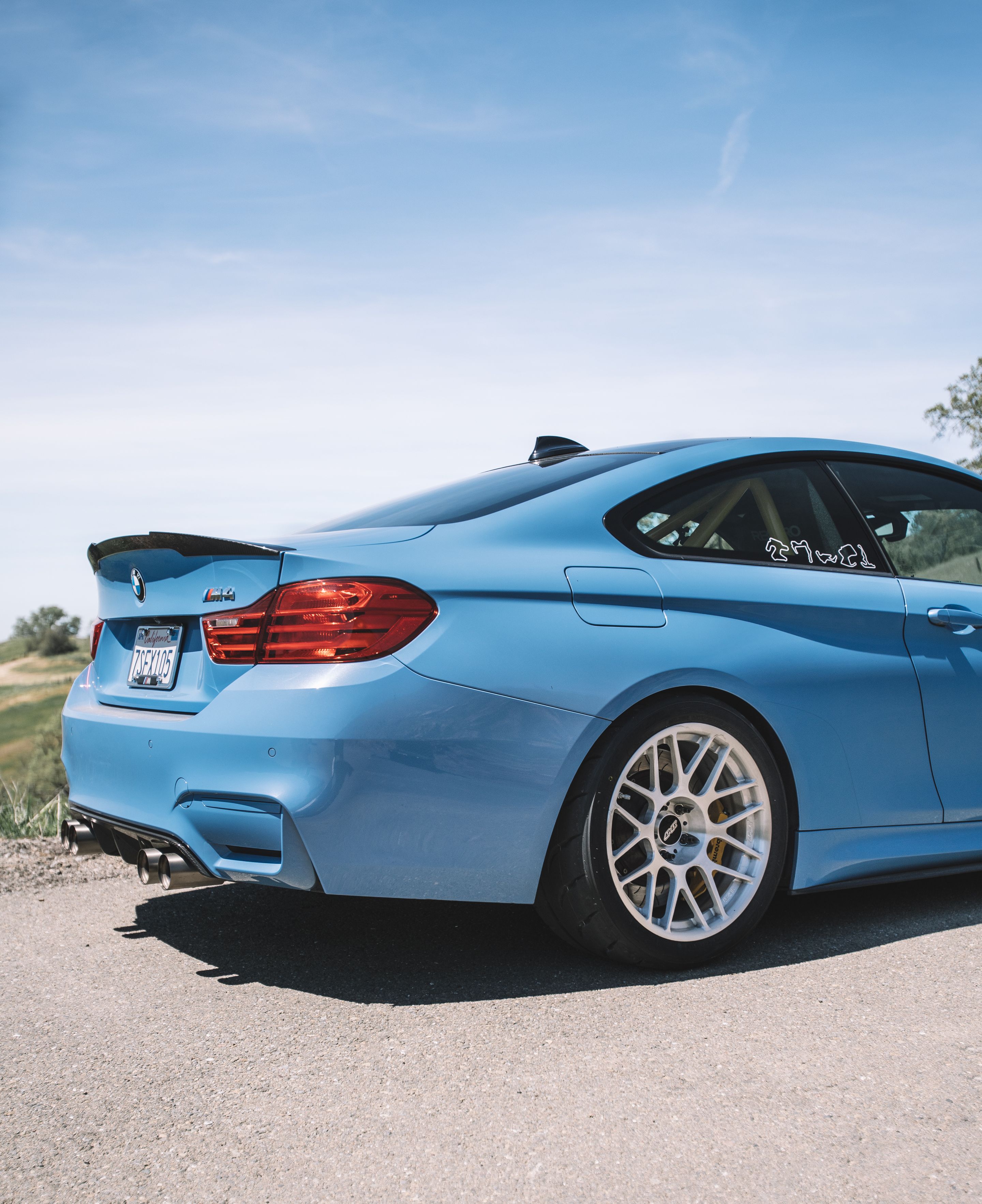 Blue BMW F82 Coupe M4 with 18" ARC-8R Apex wheels in Brushed Clear