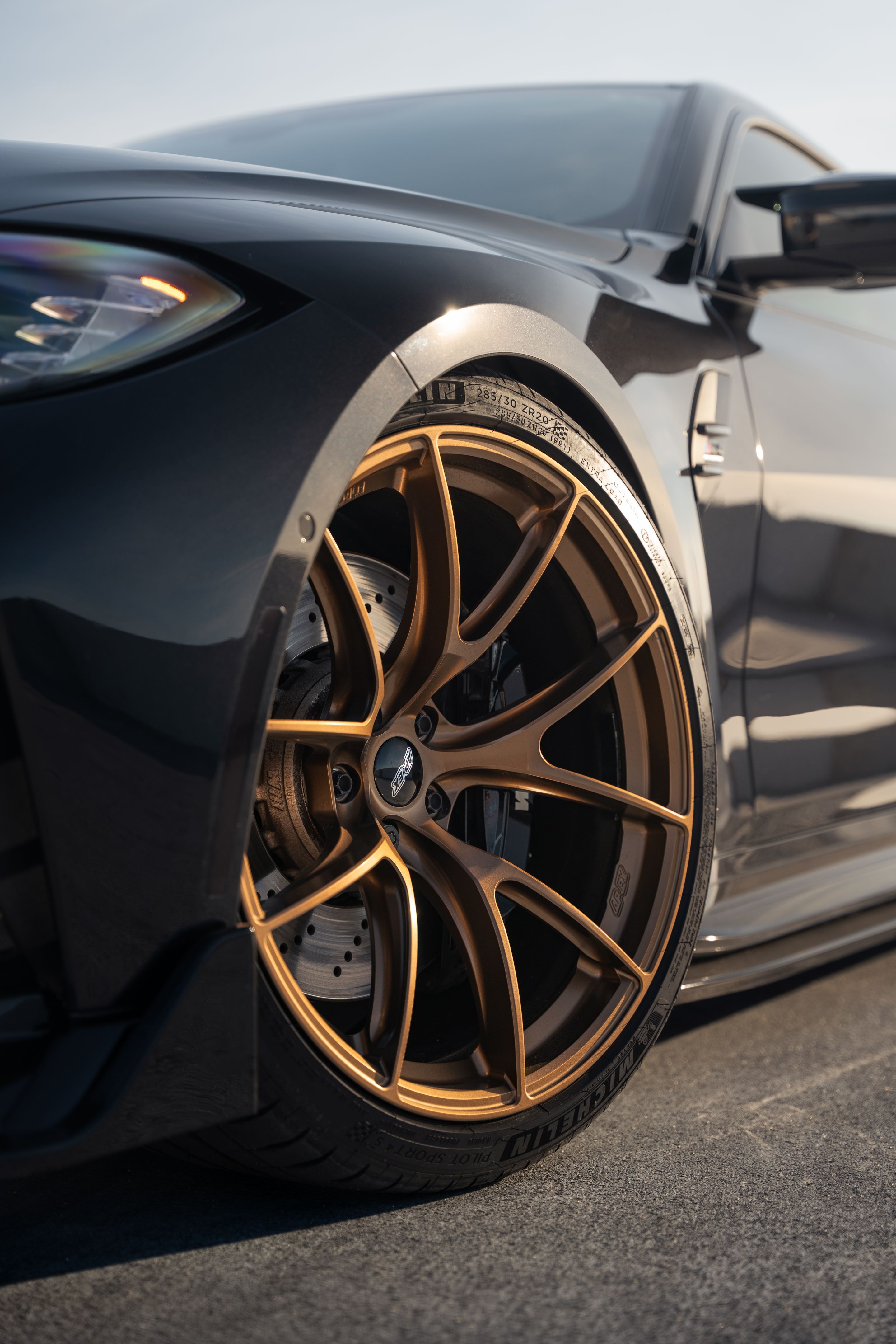 Black BMW G82 Coupe M4 with 20" VS-5RS Apex wheels in Satin Bronze