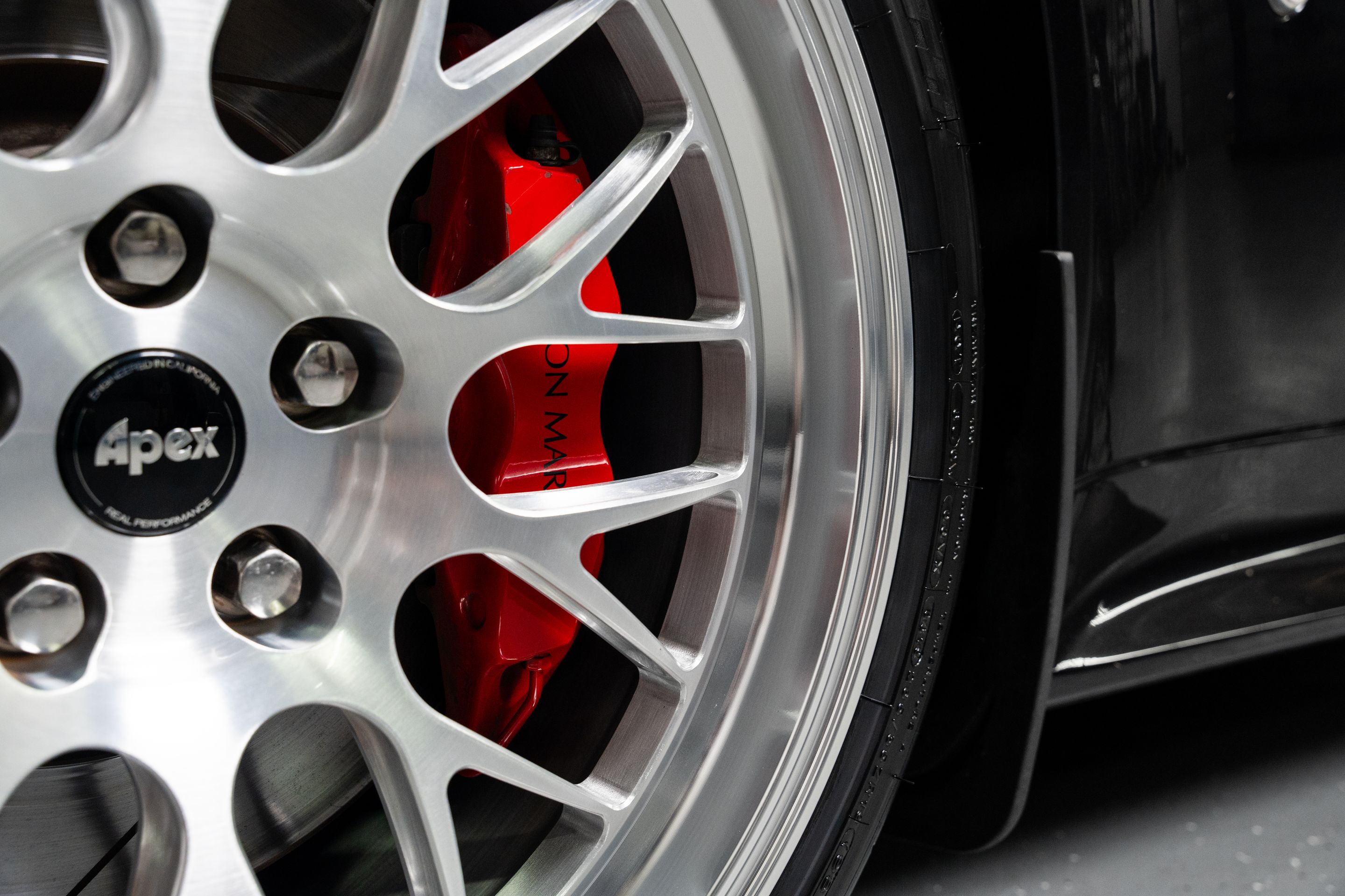 Black Aston Martin V8/V12 Vantage with 19" ML-10RT Apex wheels in Machined Lip Brushed Clear