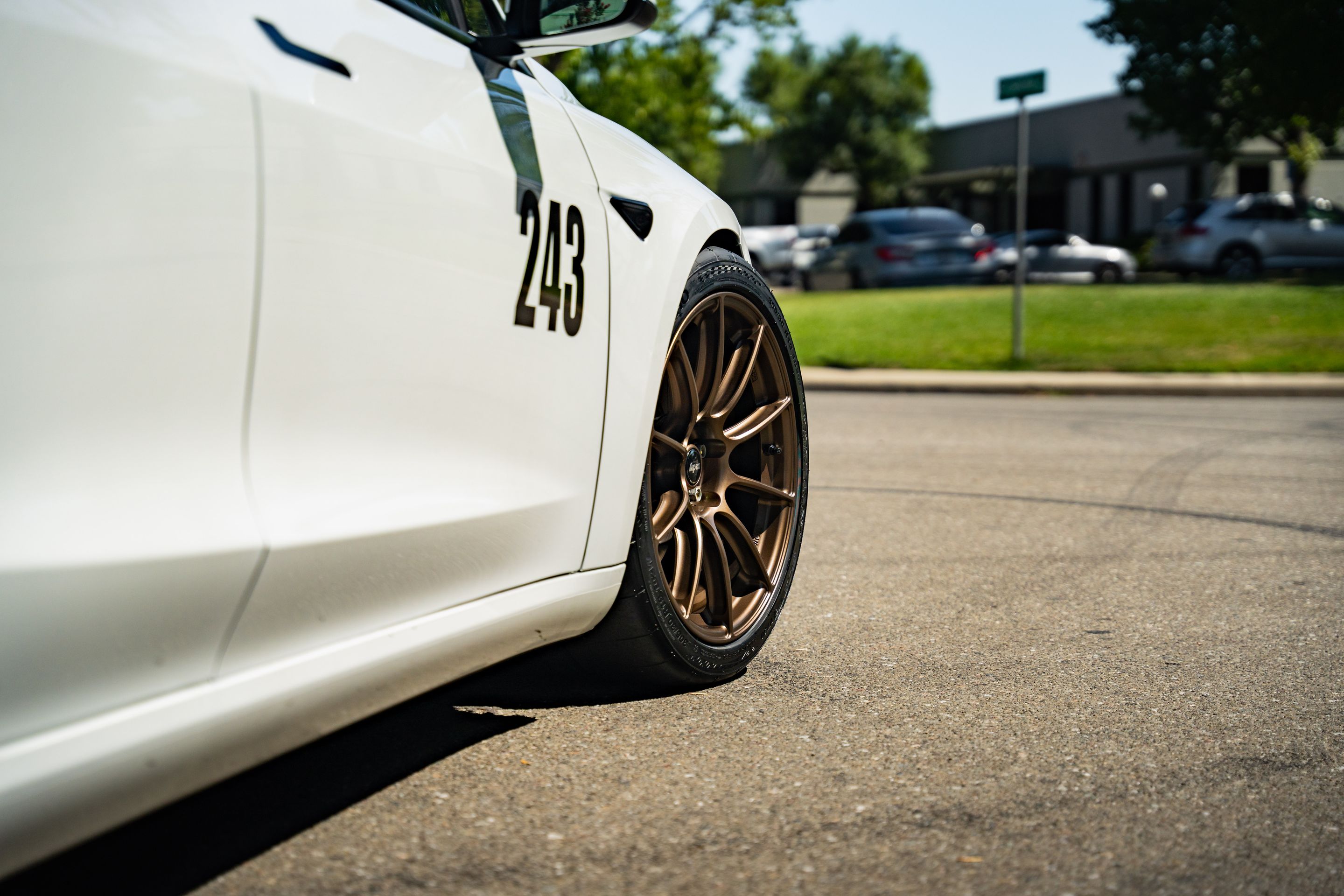 White Tesla Model 3 with 19" SM-10RS Apex wheels in Satin Bronze
