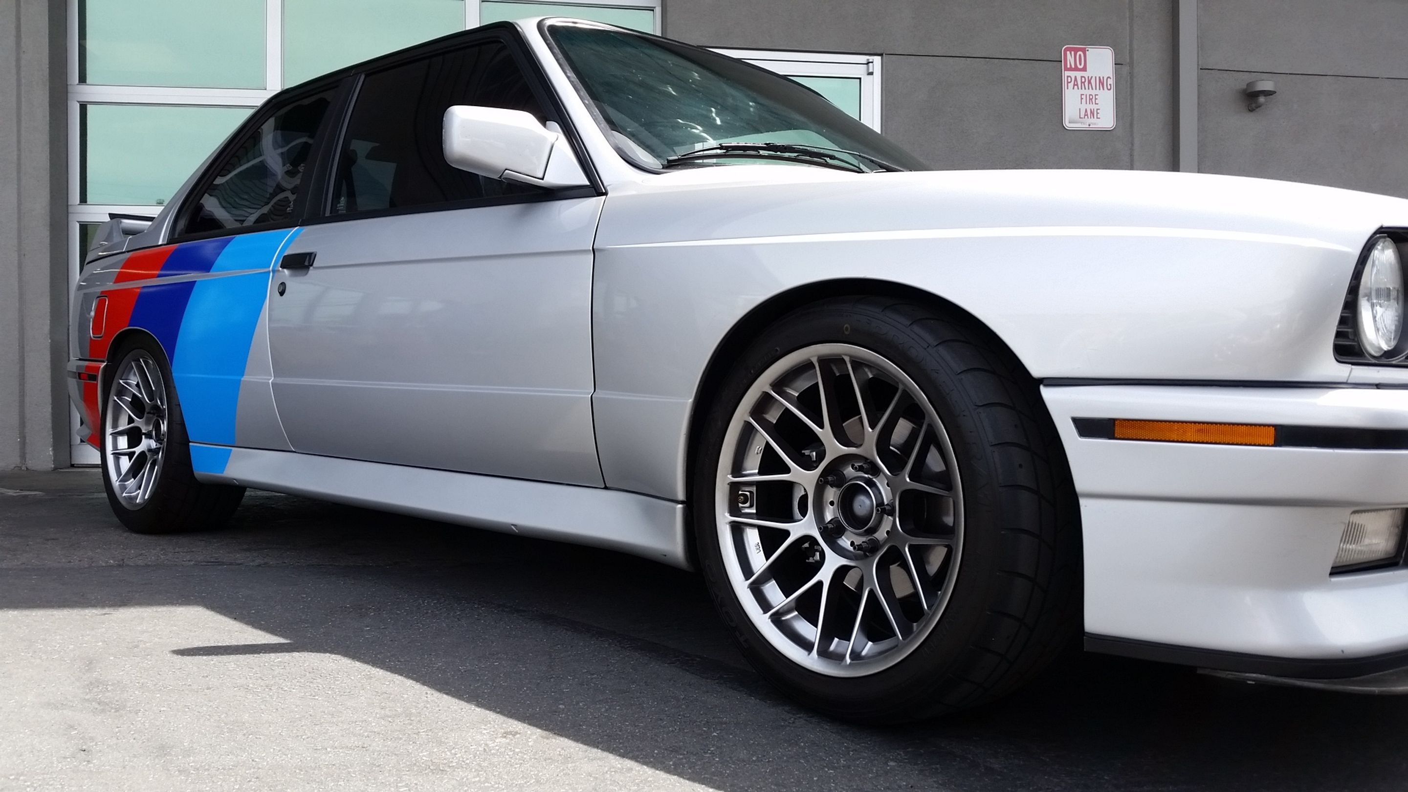 Silver BMW E30 M3 with 17" ARC-8 Apex wheels in Hyper Black