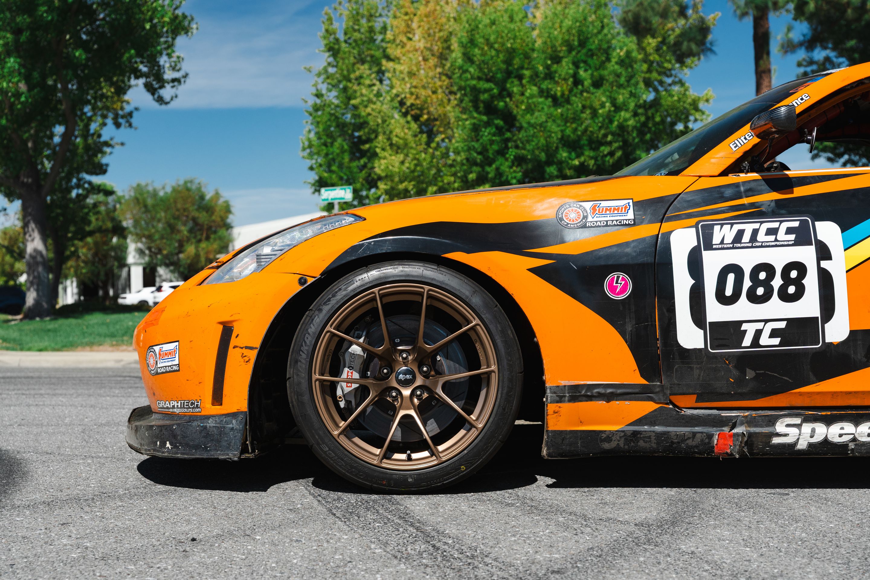 Orange Nissan 350Z with 18" VS-5RS Apex wheels in Satin Bronze