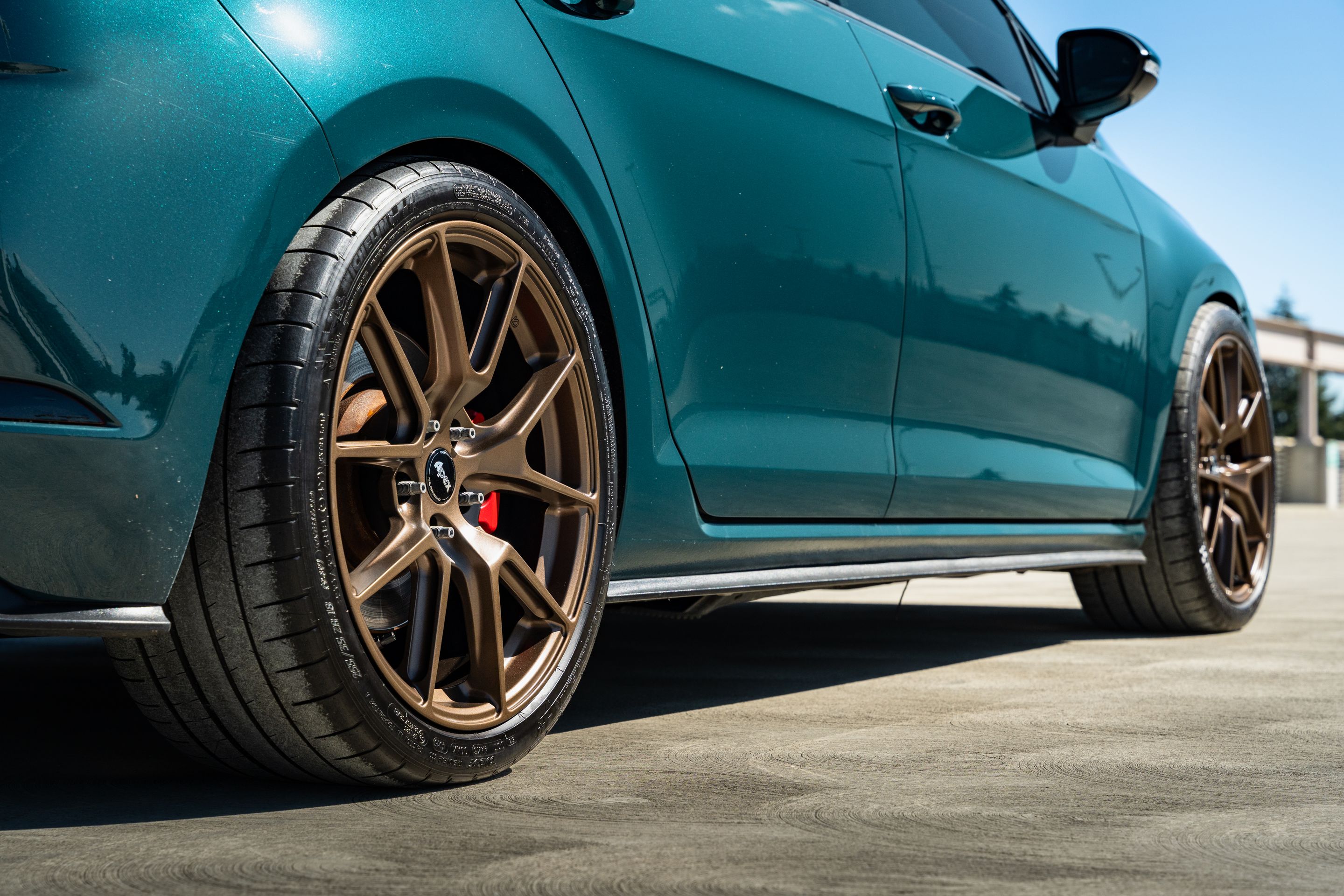 Green VW MK7 GTI with 18" VS-5 Apex wheels in Satin Bronze