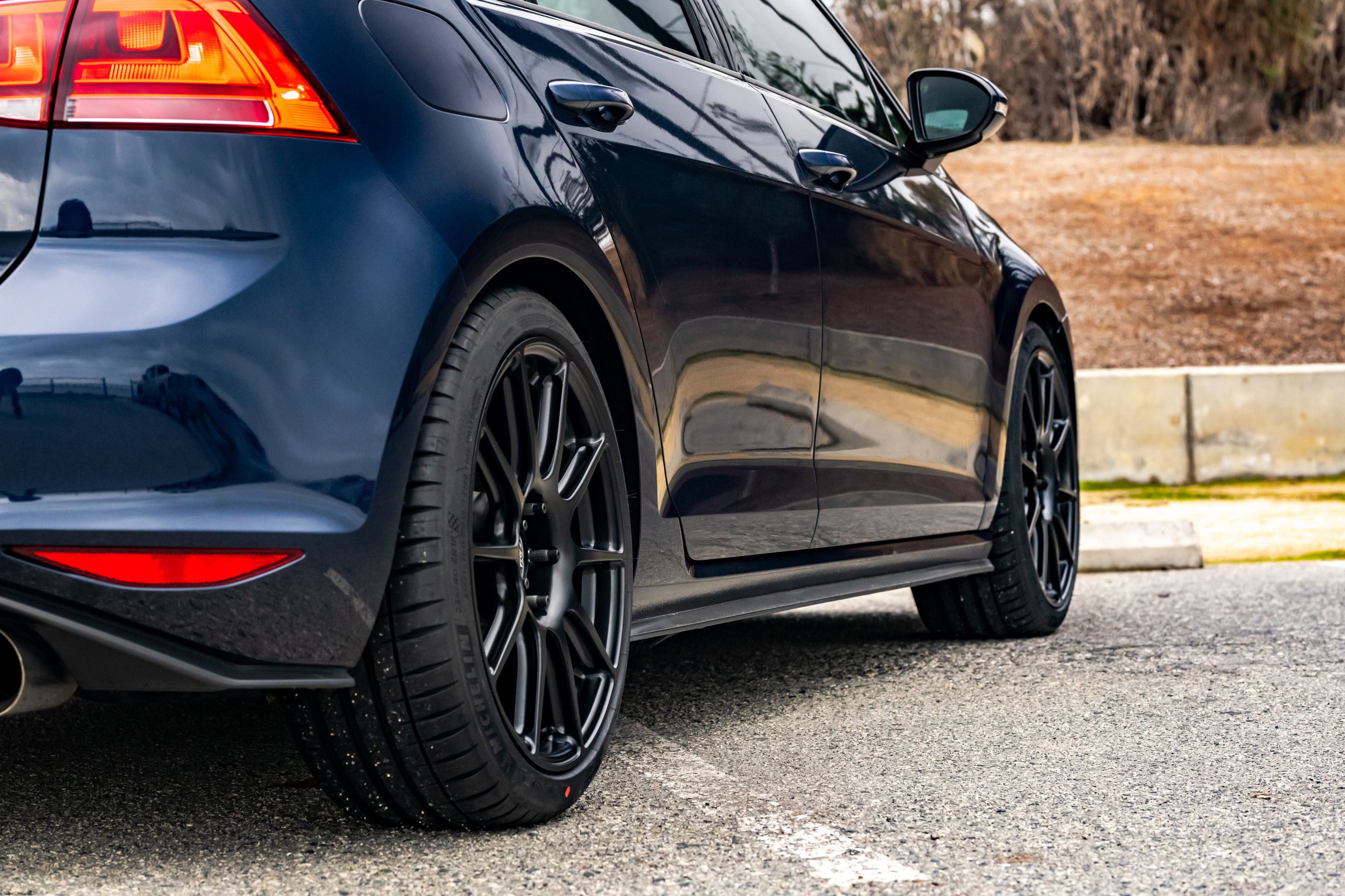 Blue VW MK7 GTI with 18" SM-10 Apex wheels in Satin Black