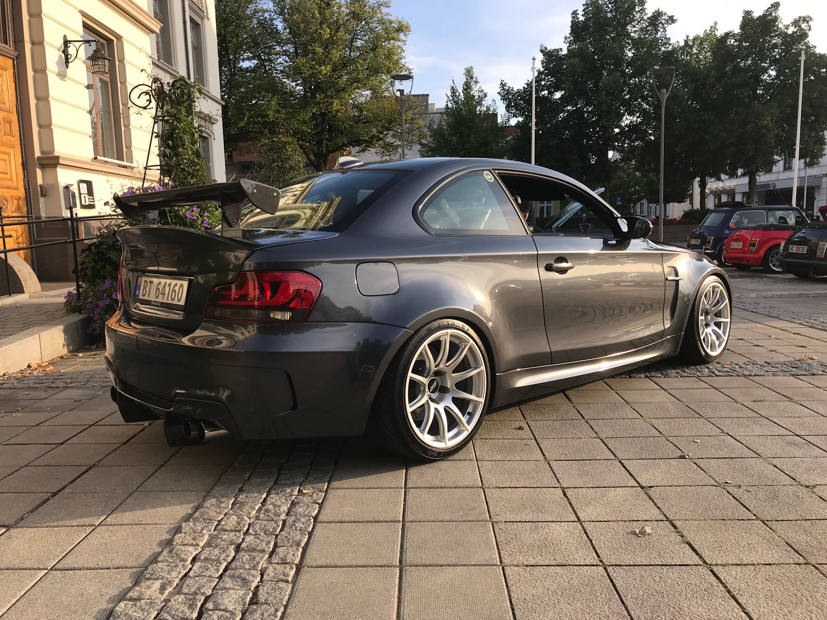Grey BMW E82 1M with 18" SM-10 Apex wheels in Satin Black