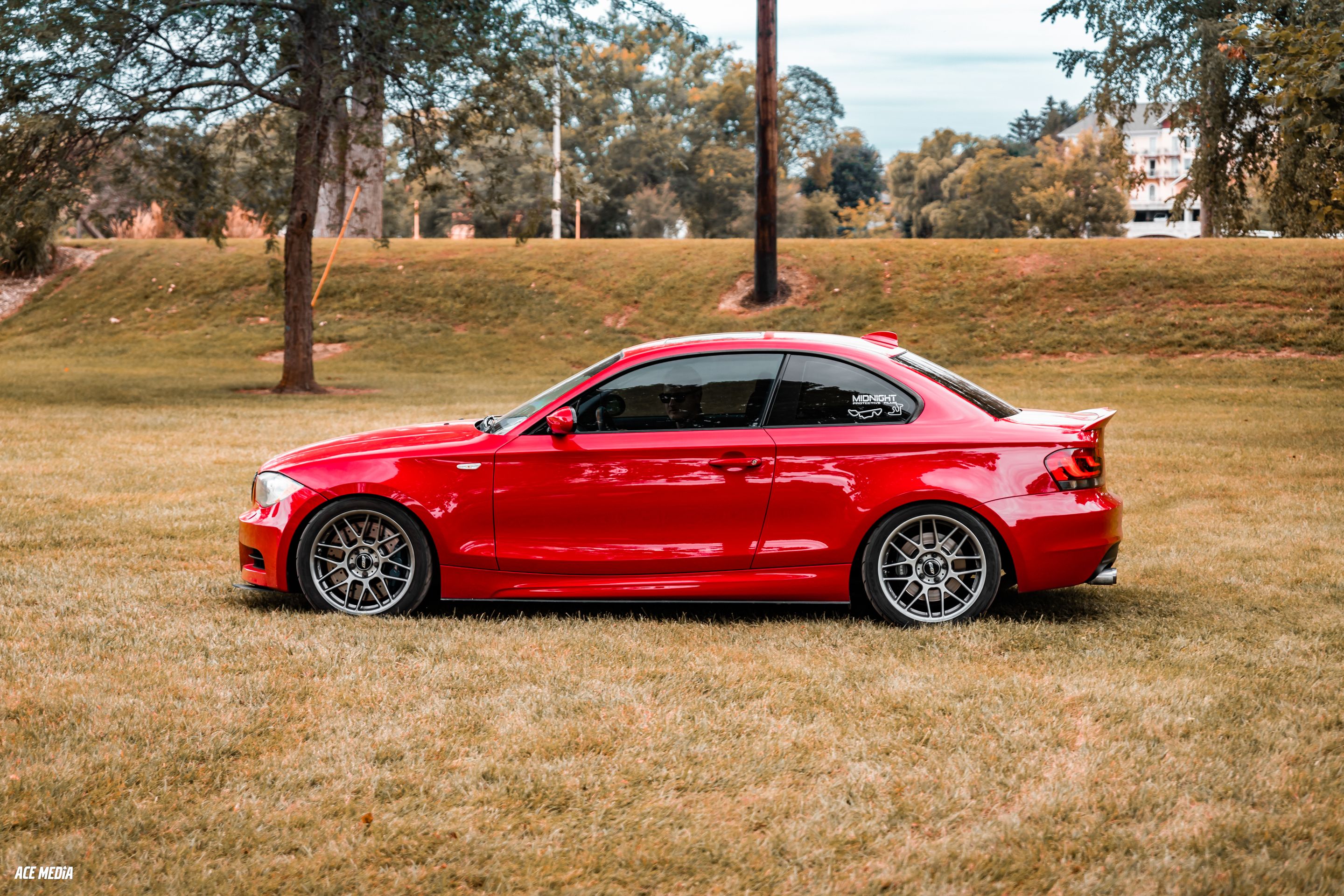 Red BMW E82 Coupe 1 Series with 18" ARC-8 Apex wheels in Hyper Black