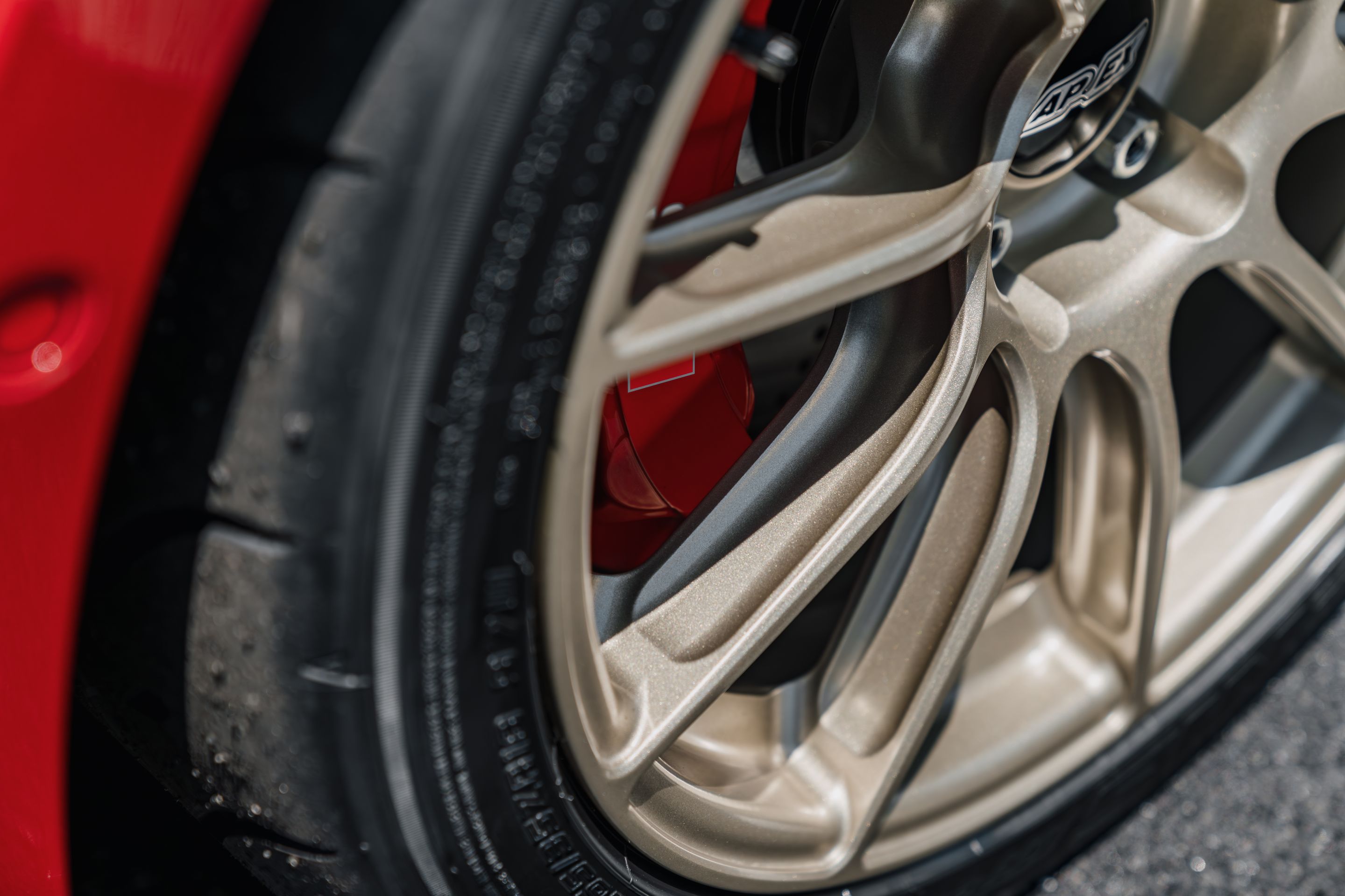 Red Audi 8Y RS 3 with 18" SM-10RS Apex wheels in Motorsport Gold