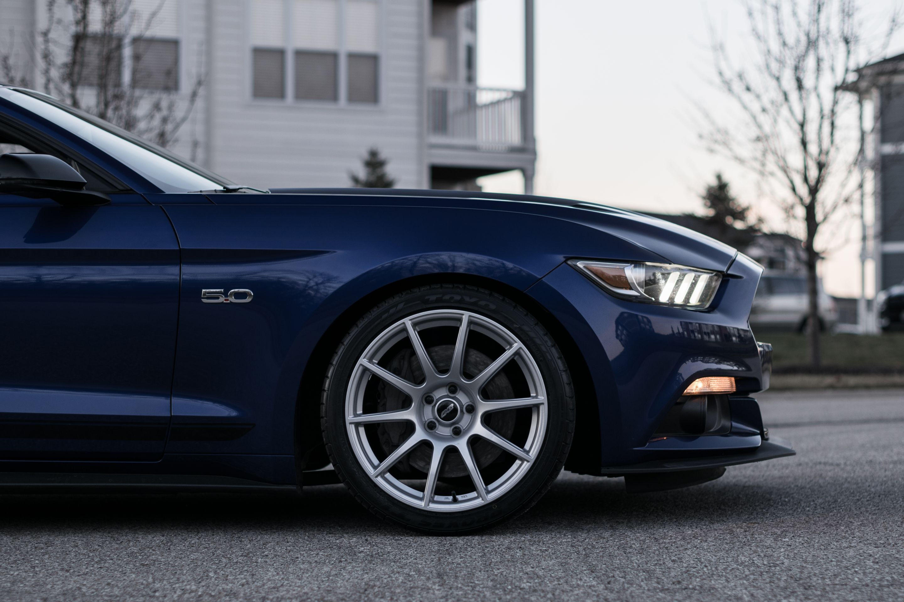 Blue Ford S550 Mustang GT with 19" SM-10 Apex wheels in Race Silver