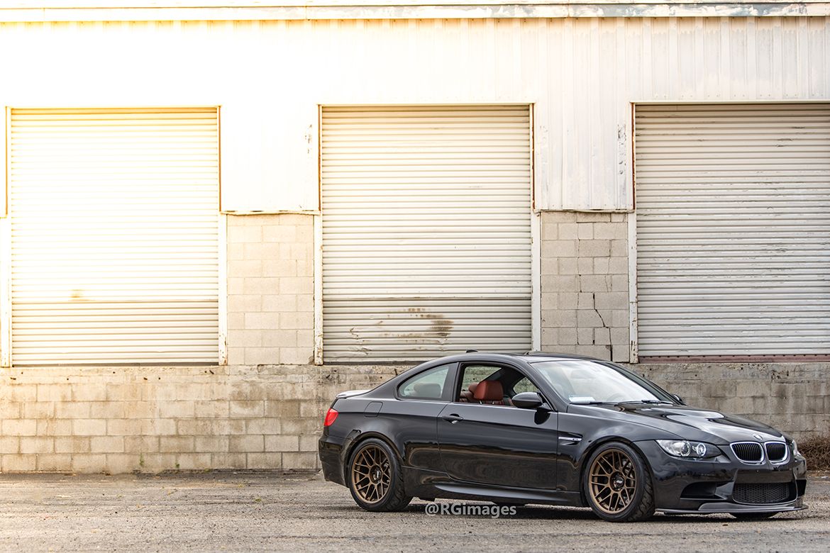 Black BMW E92 Coupe M3 with 18" ARC-8 Apex wheels in Satin Bronze