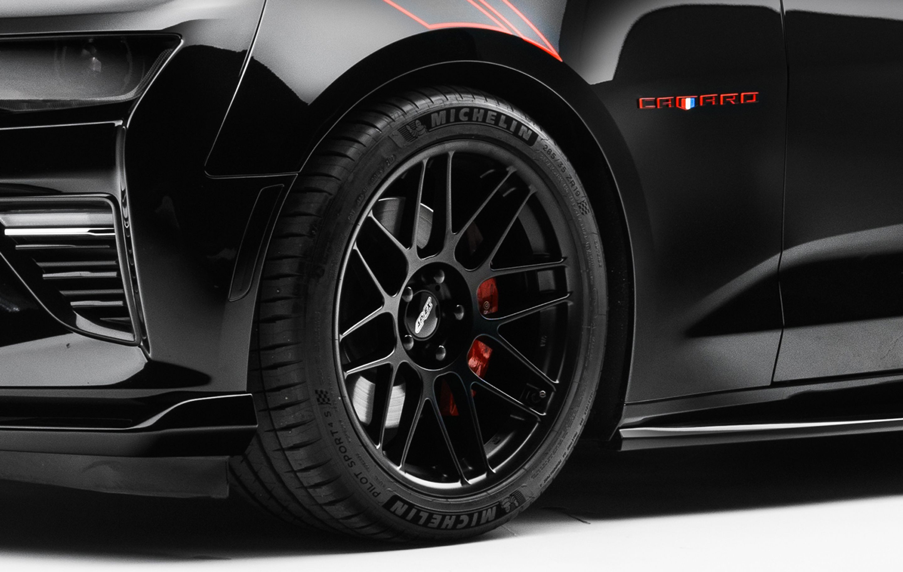 Black Chevrolet 6th Gen Camaro SS with 19" ARC-8 Apex wheels in Satin Black