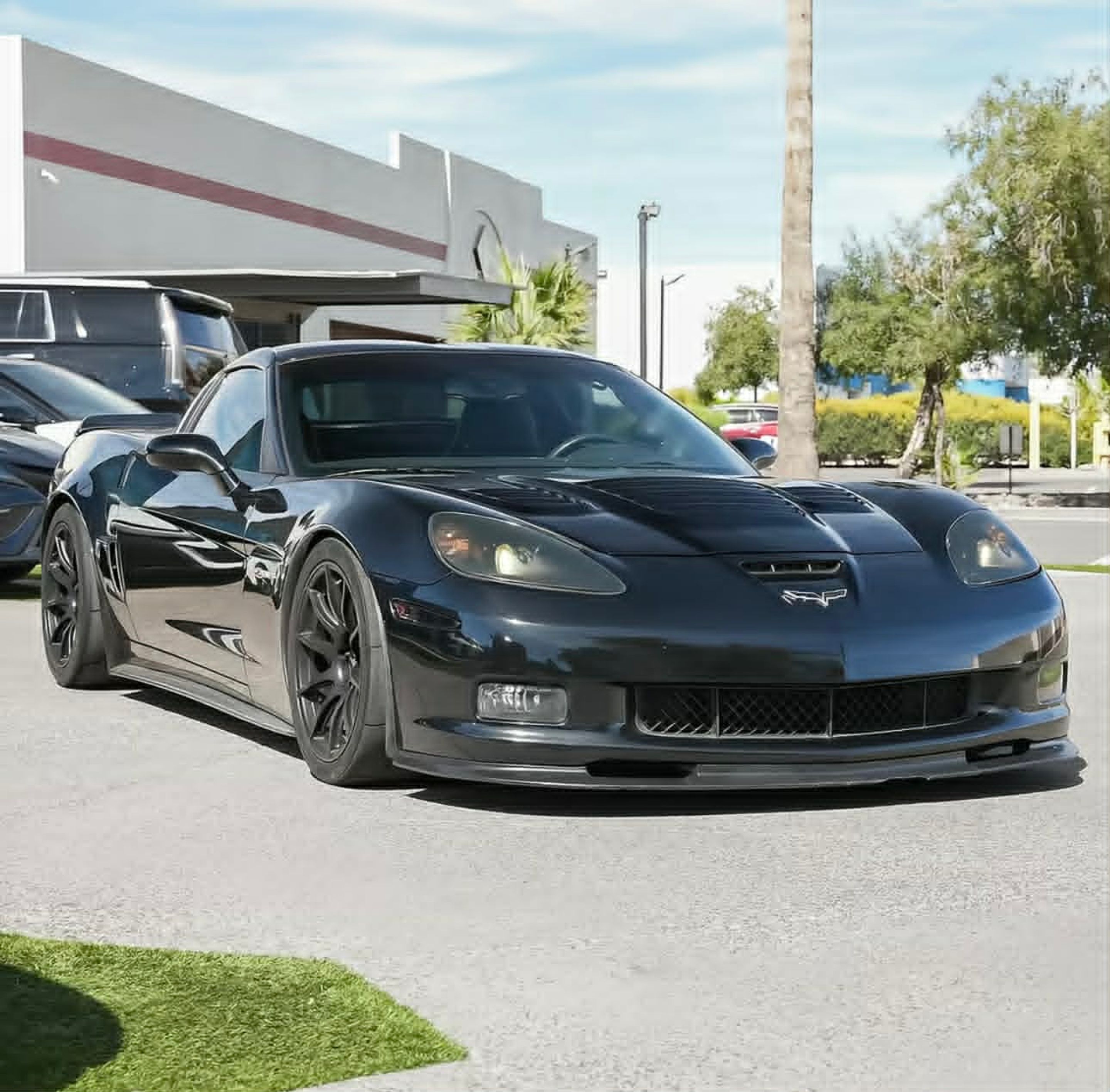 Black Chevrolet C6 Corvette Z06 with 18" SM-10 Apex wheels in Satin Black