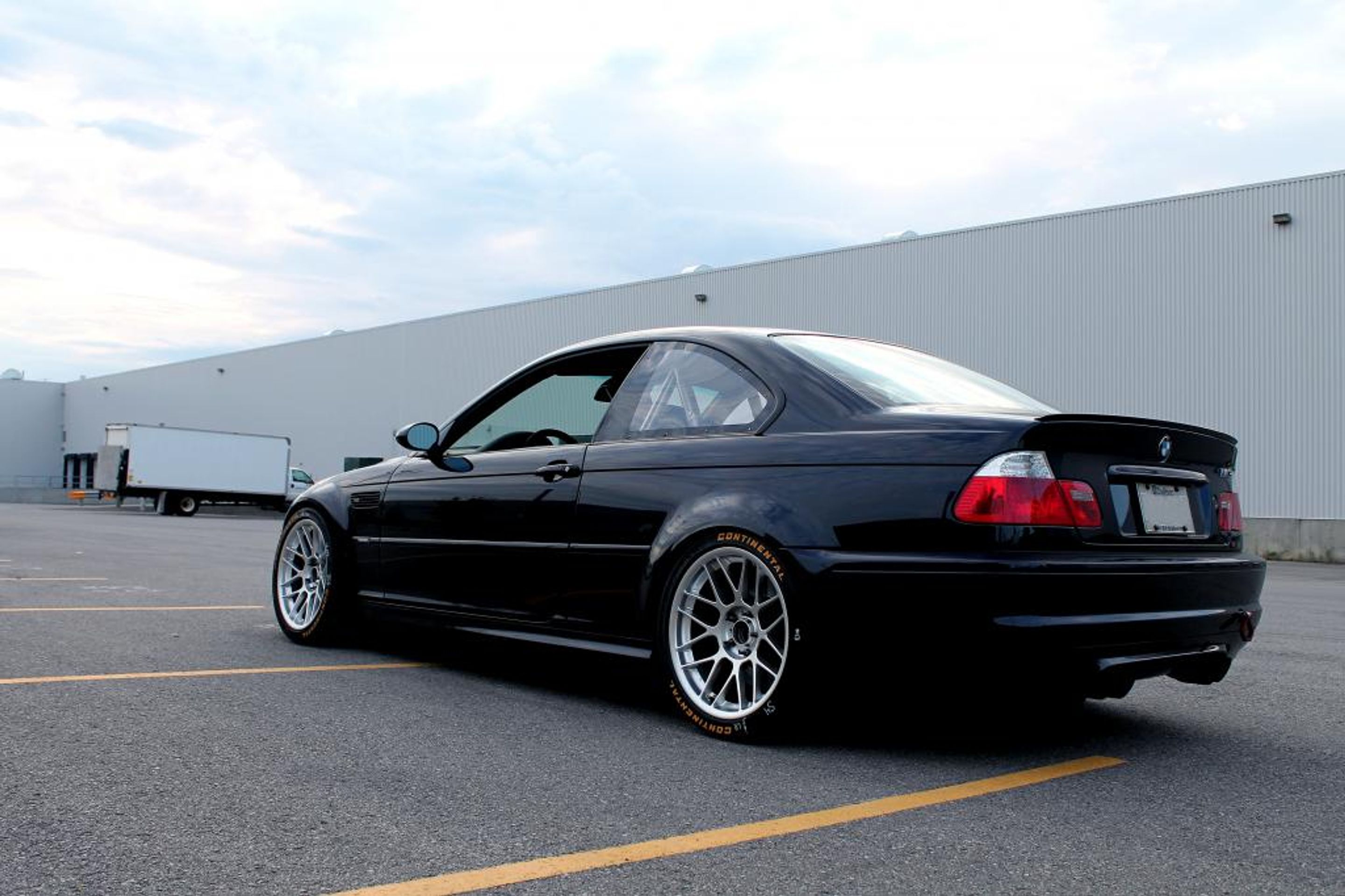 Black BMW E46 M3 with 18" ARC-8 Apex wheels in Hyper Silver