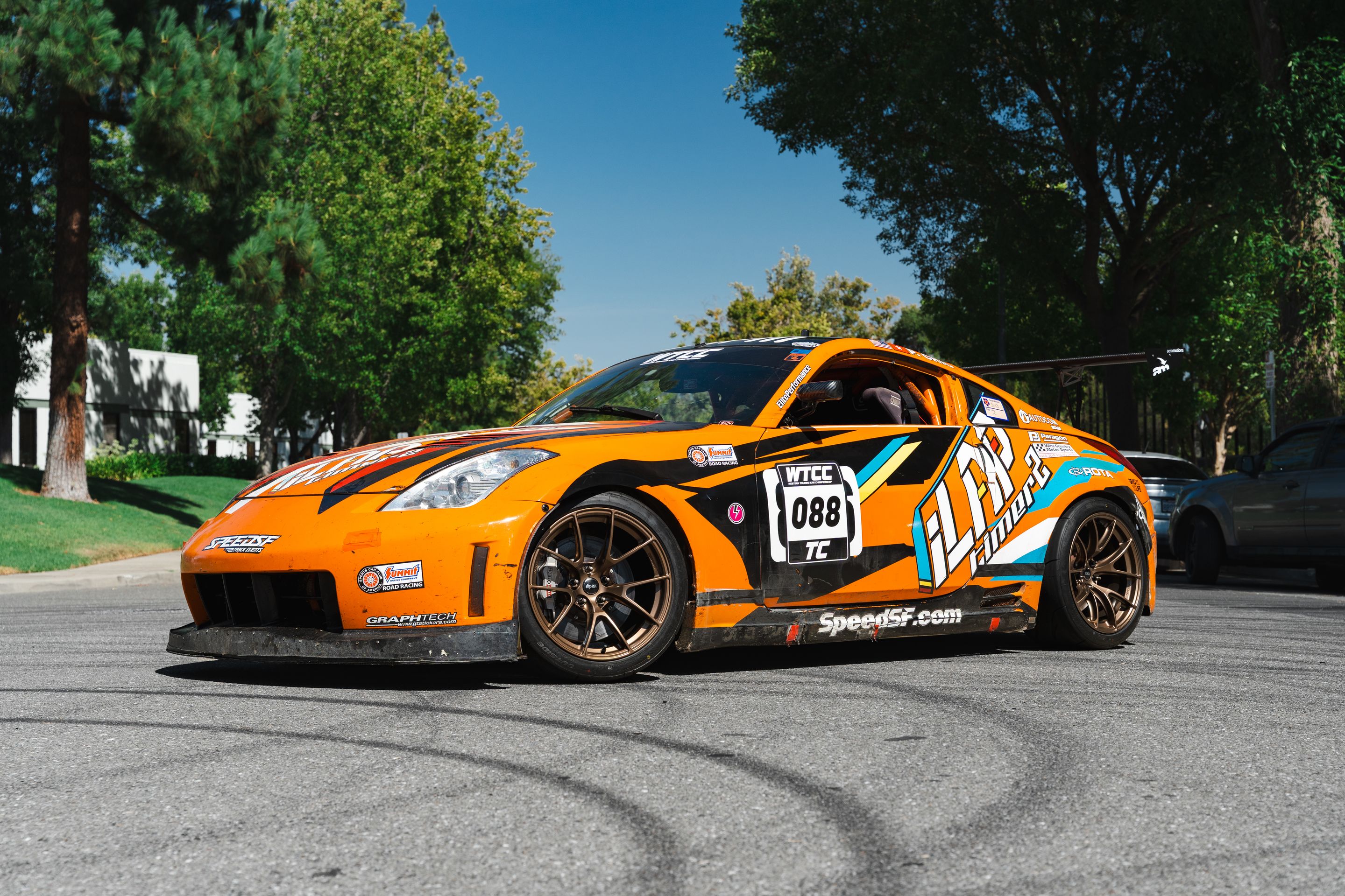 Orange Nissan 350Z with 18" VS-5RS Apex wheels in Satin Bronze