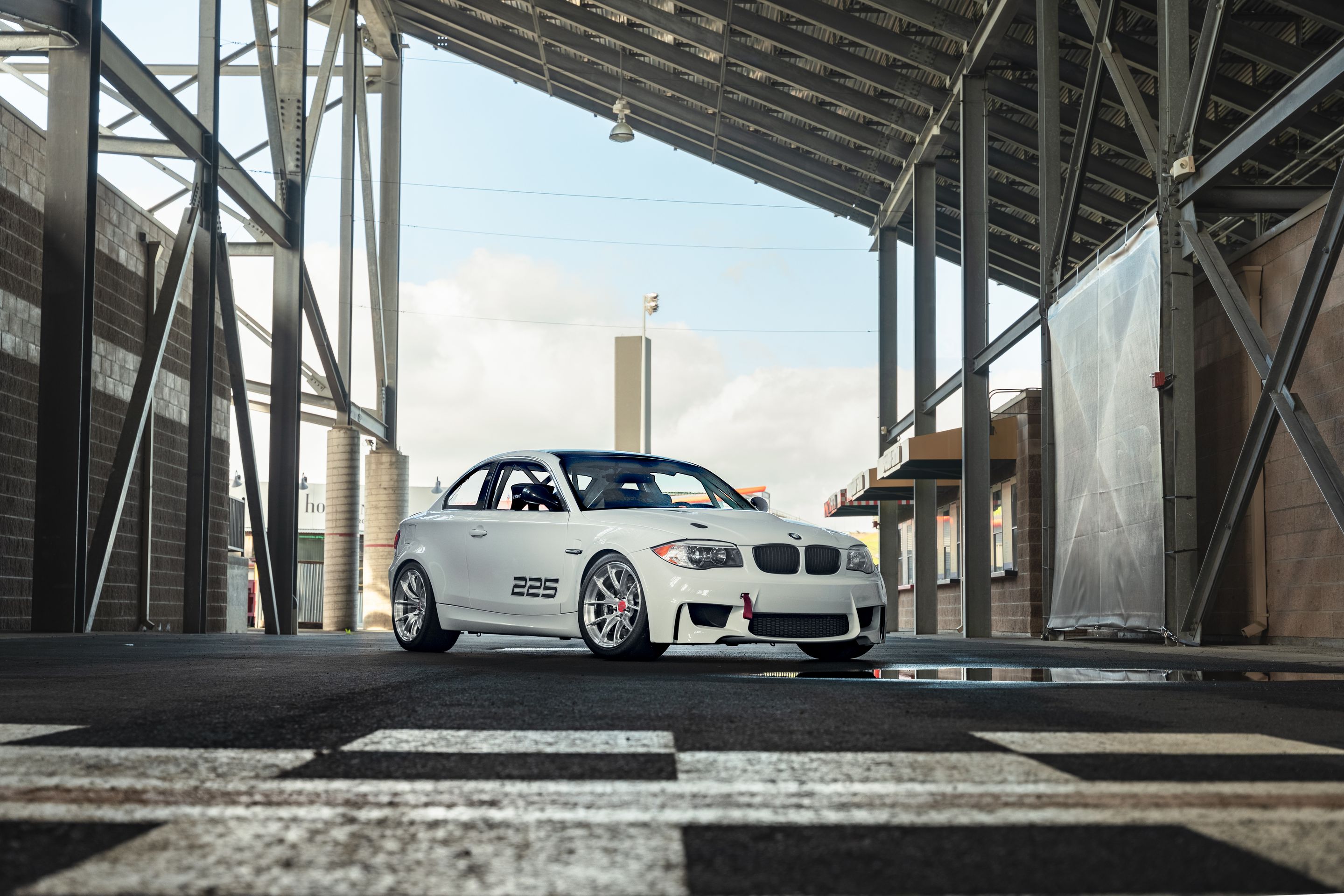 White BMW E82 1M with 18" VS-5RS Apex wheels in Brushed Clear