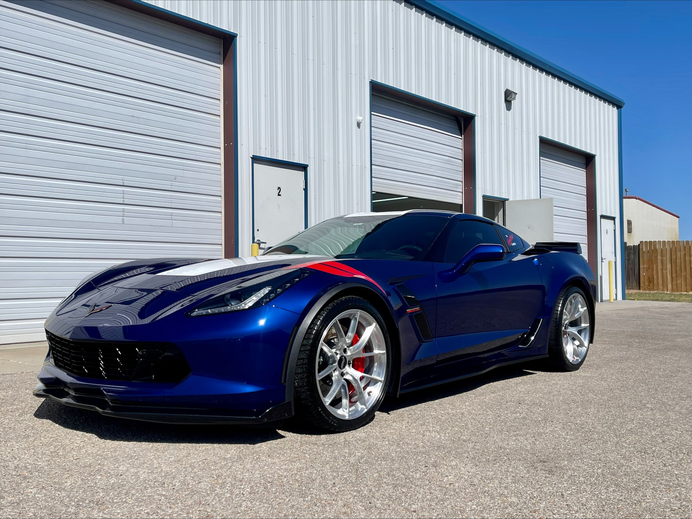 Blue Chevrolet C7 Corvette Grand Sport with 19"/20" VS-5RS Apex wheels in Brushed Clear