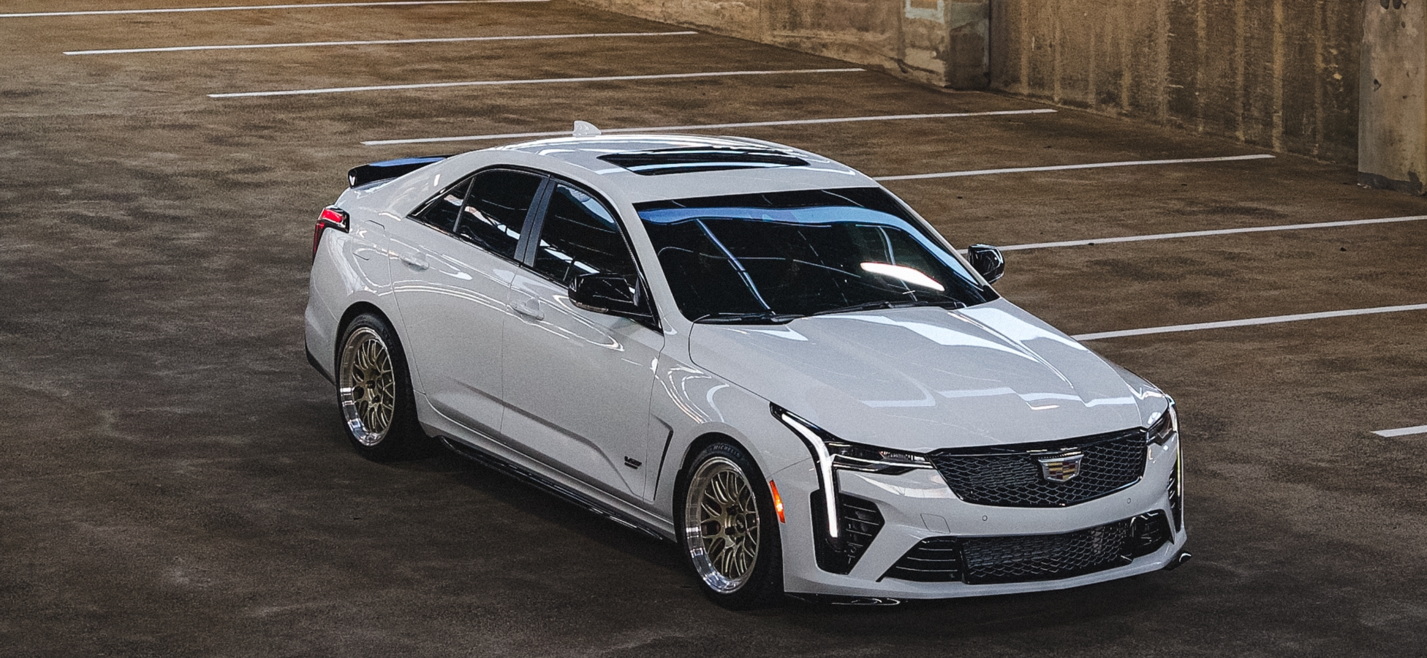White Cadillac CT4-V Blackwing with 18" ML-10RT Apex wheels in Machined Lip Gloss Motorsport Gold