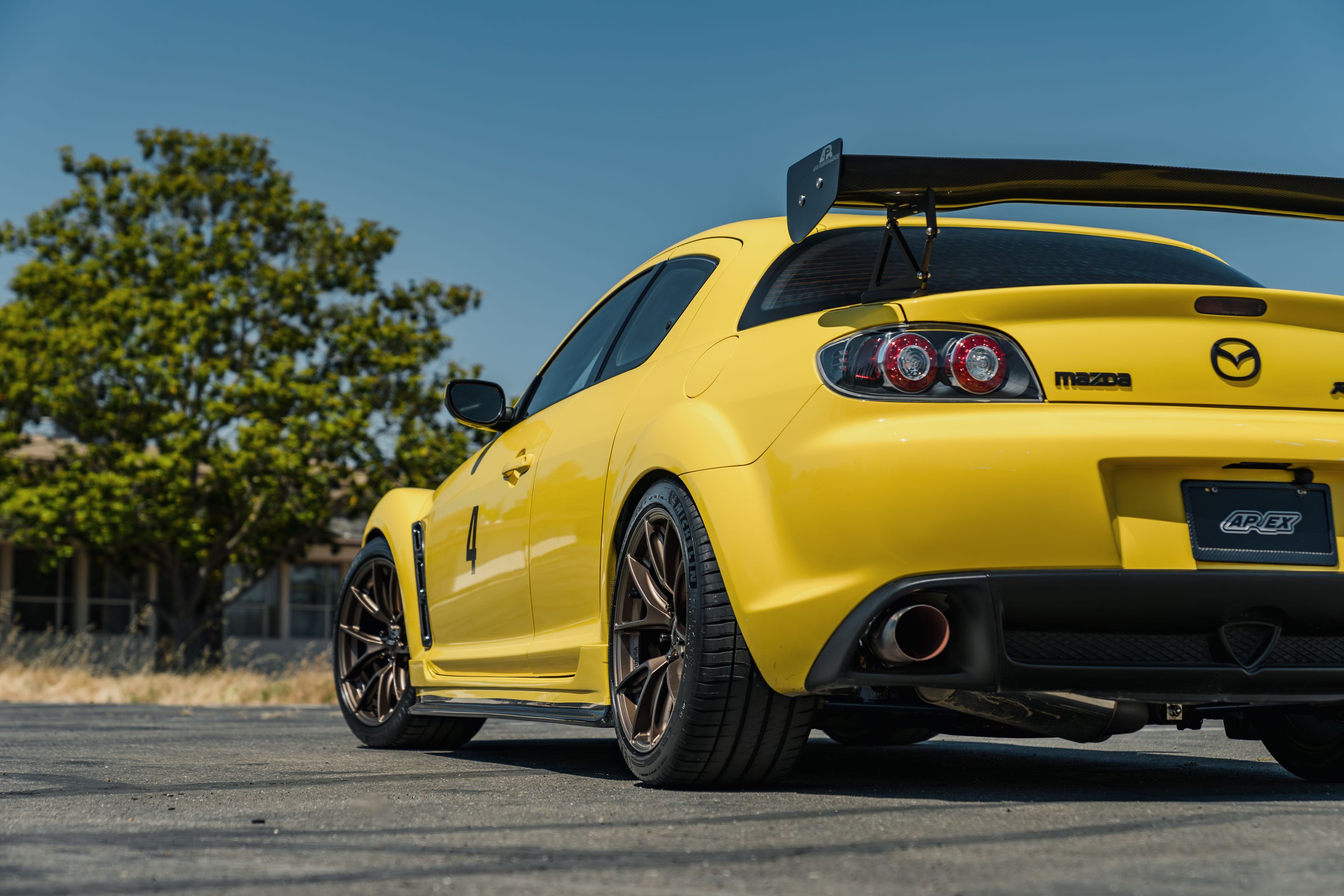 Yellow Mazda RX-8 with 18" VS-5RS Apex wheels in Satin Bronze