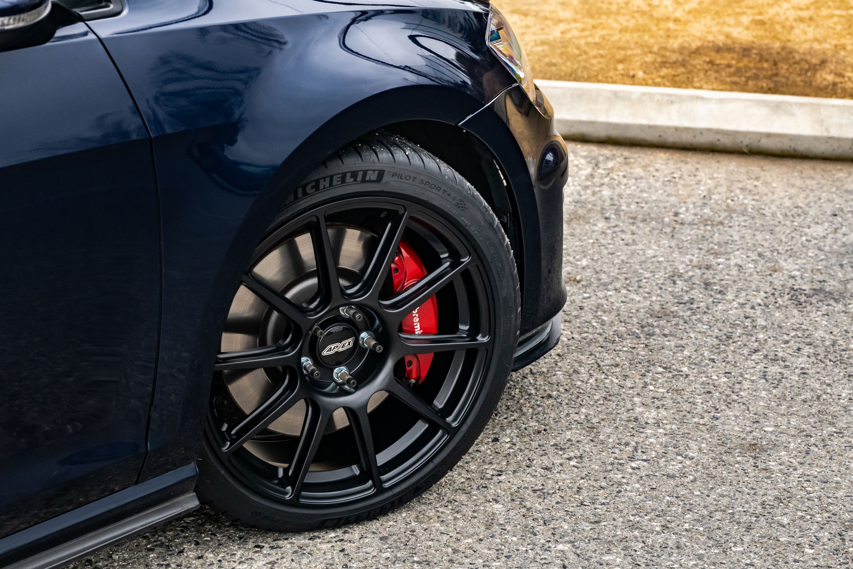 Blue VW MK7 GTI with 18" SM-10 Apex wheels in Satin Black