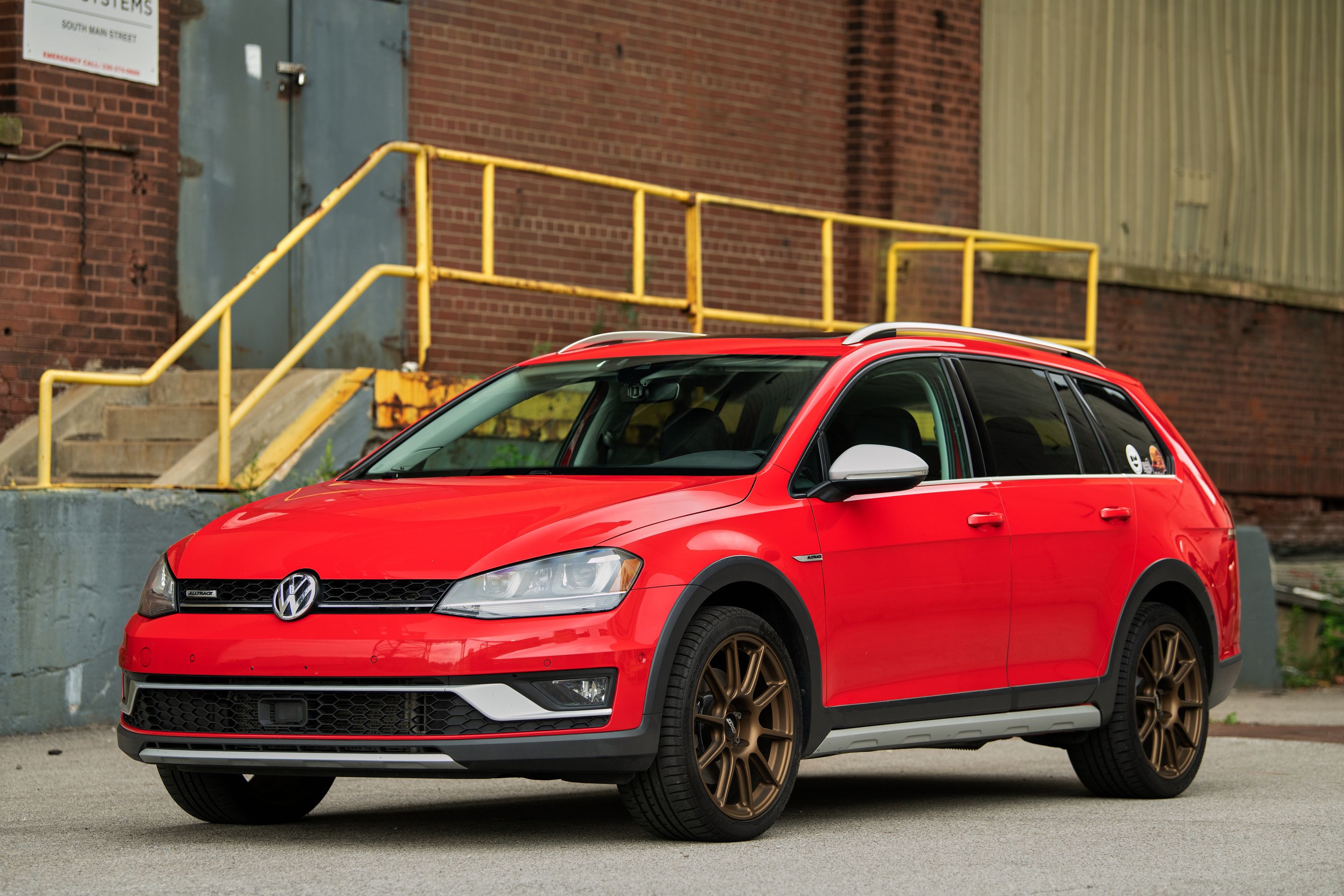 Red VW MK7 Alltrack/SportWagen Alltrack with 18" SM-10 Apex wheels in Satin Bronze