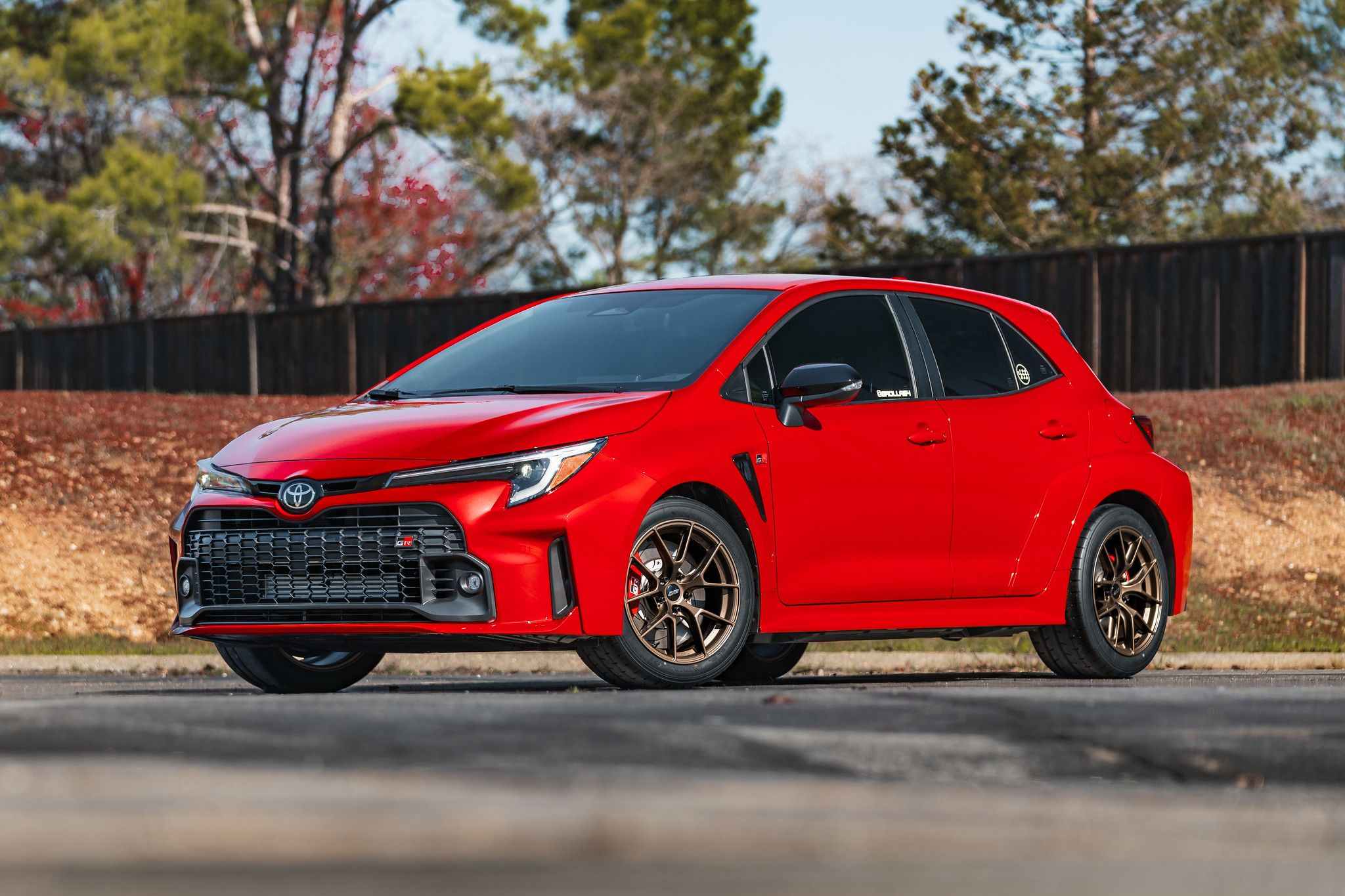 Red Toyota GR Corolla with 17" VS-5RS Apex wheels in Satin Bronze