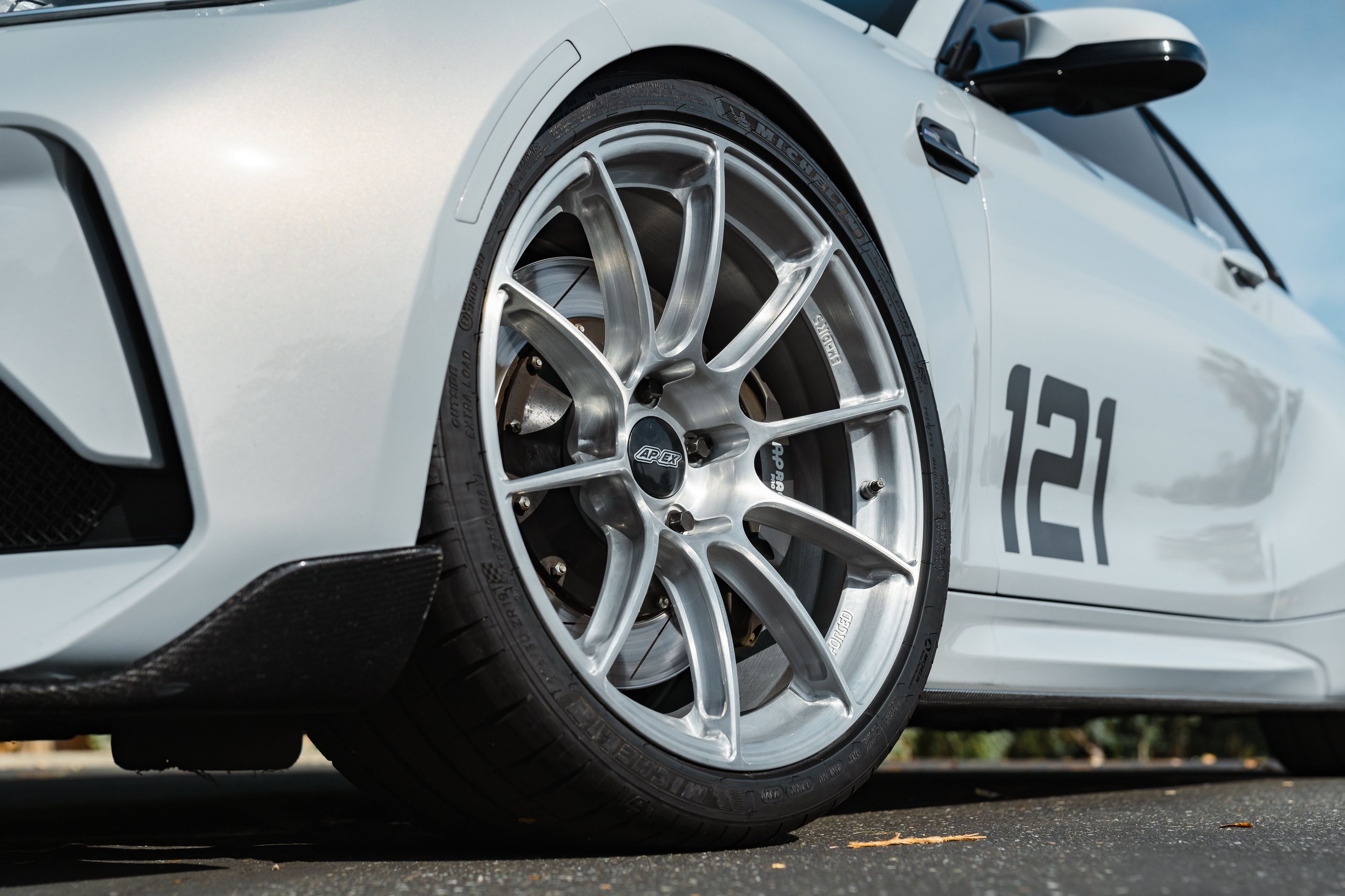 Silver BMW F87 M2 with 19" SM-10RS Apex wheels in Brushed Clear