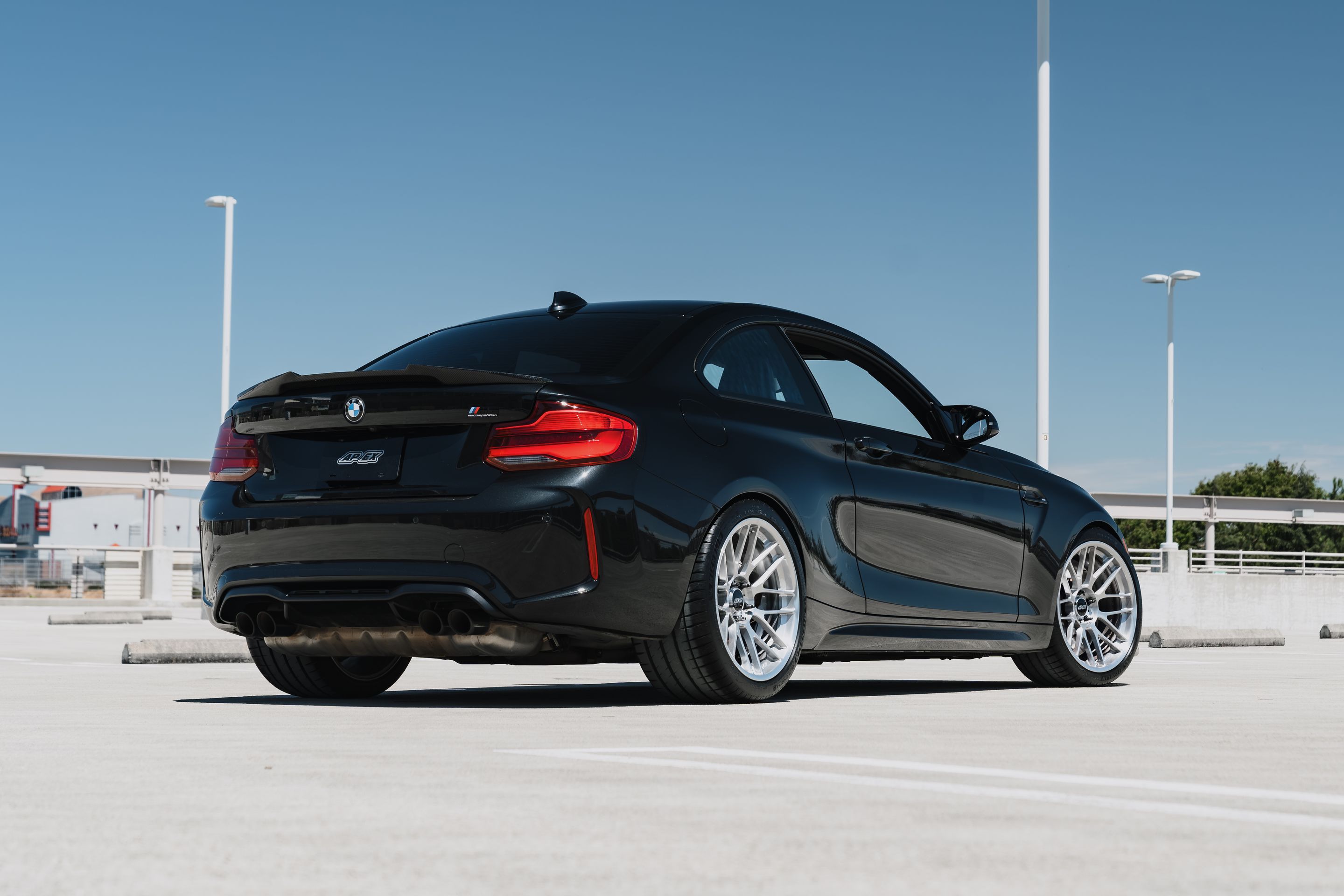 Black BMW F87 M2 with 19" ARC-8RT Apex wheels in Brushed Clear