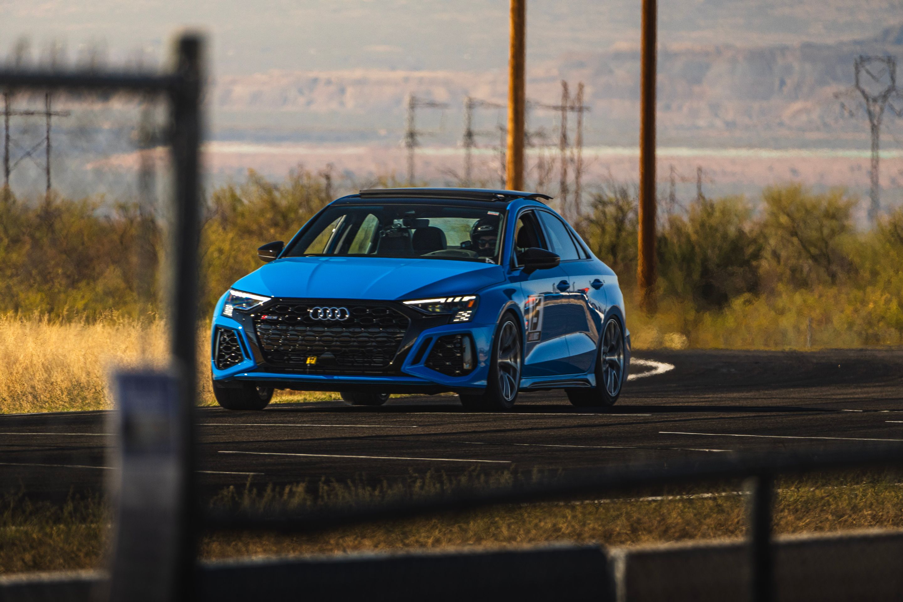 Blue Audi 8Y RS 3 with 18" VS-5RS Apex wheels in Brushed Clear